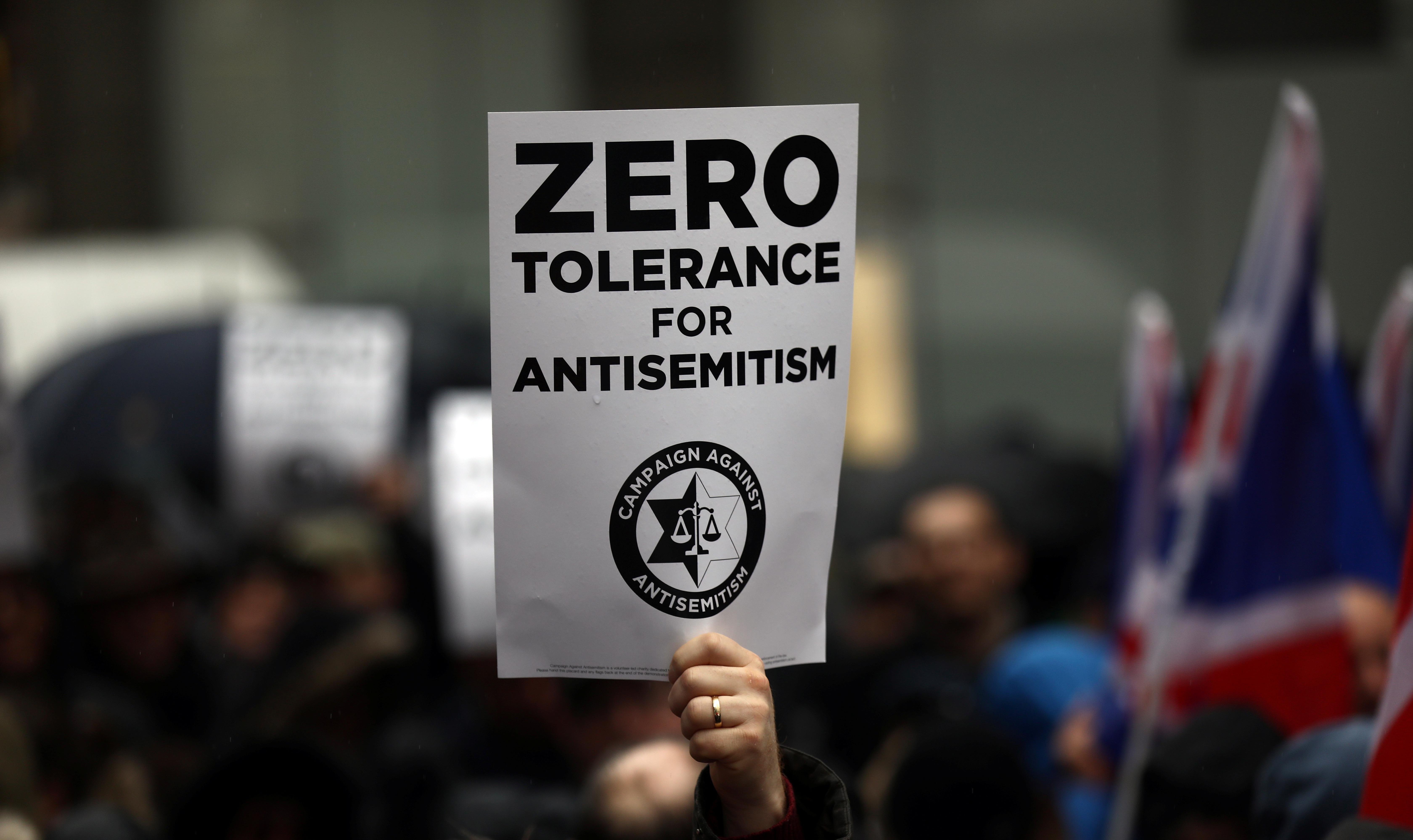 Demonstrators take part in an antisemitism protest outside the Labour Party headquarters in central London