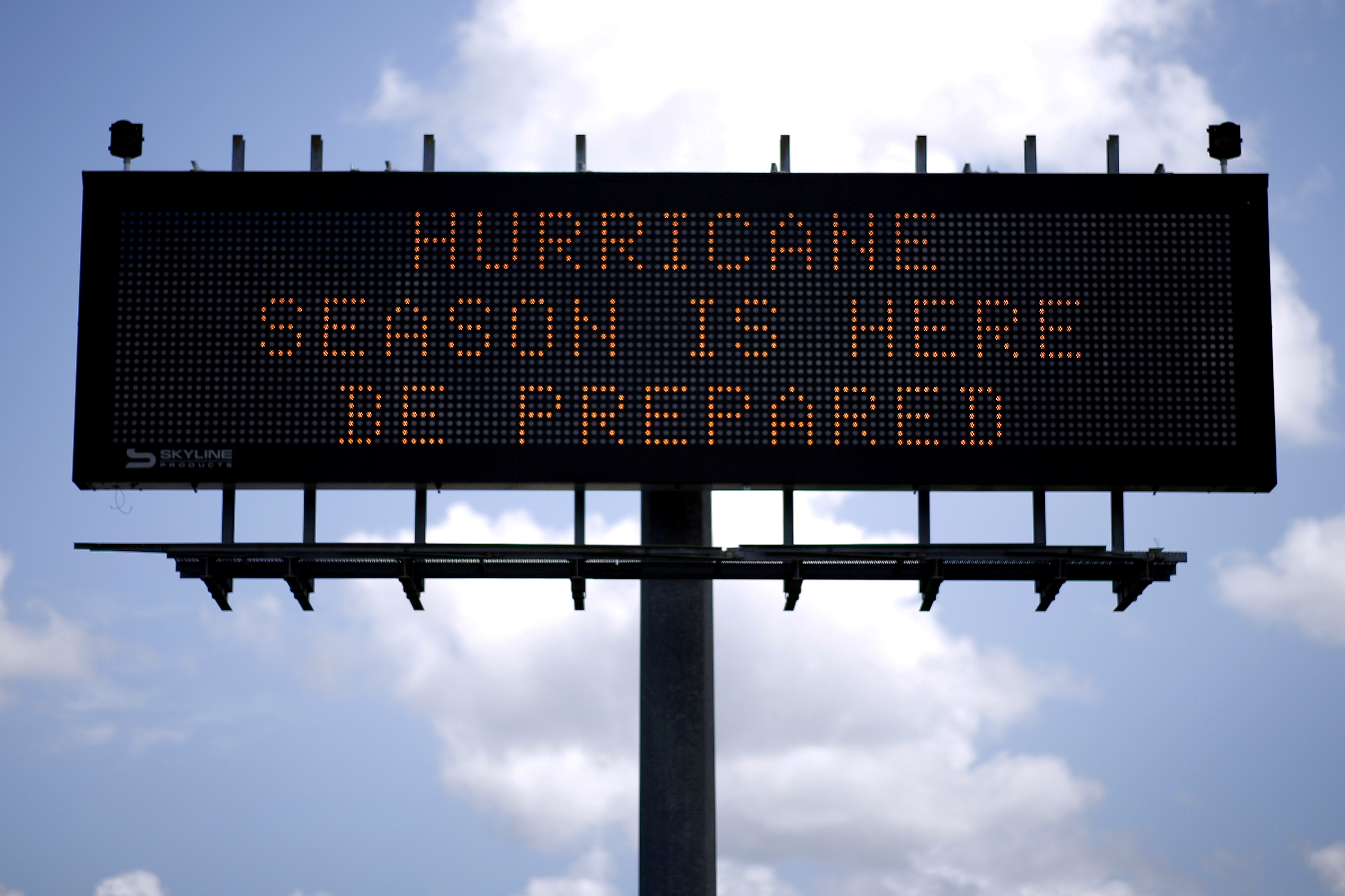 FILE PHOTO: A traffic sign warns of hurricane season in Stowell, Texas, U.S., June 12, 2018. Picture taken June 12, 2018. REUTERS/Jonathan Bachman/File Photo
