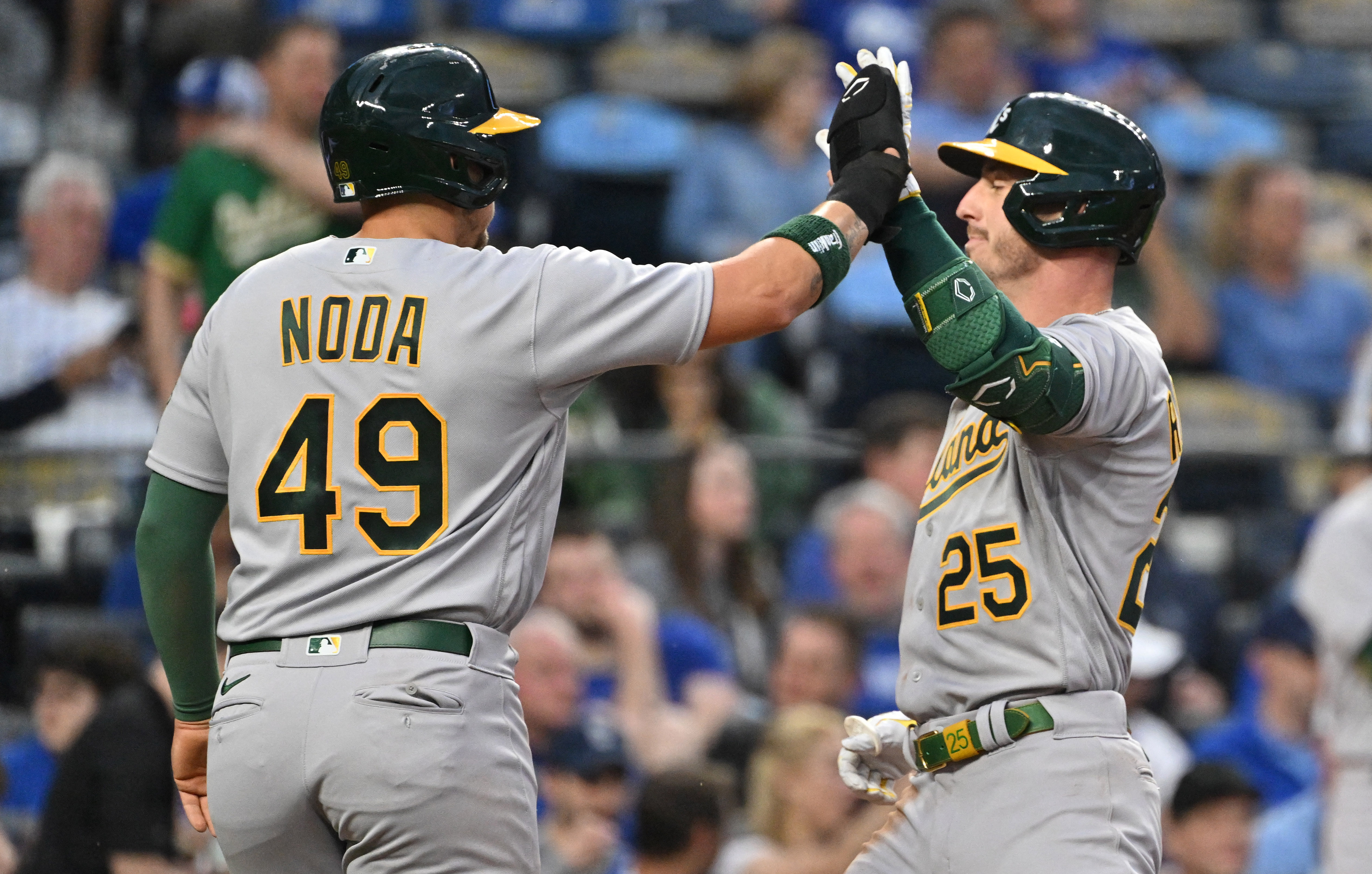 A's score big, hold off Royals' comeback bid