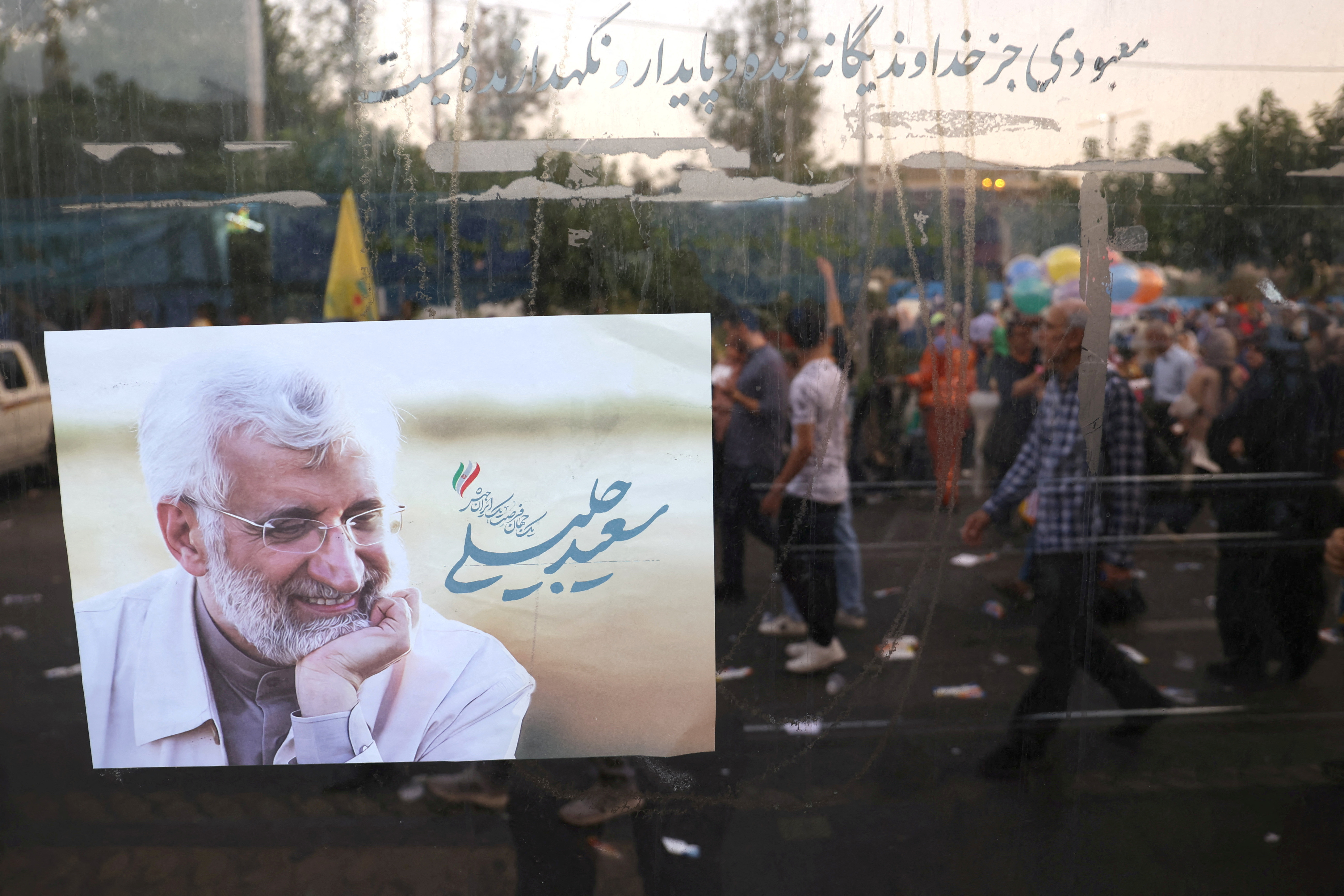 A poster of Iranian presidential candidate Saeed Jalili is seen on a street in Tehran