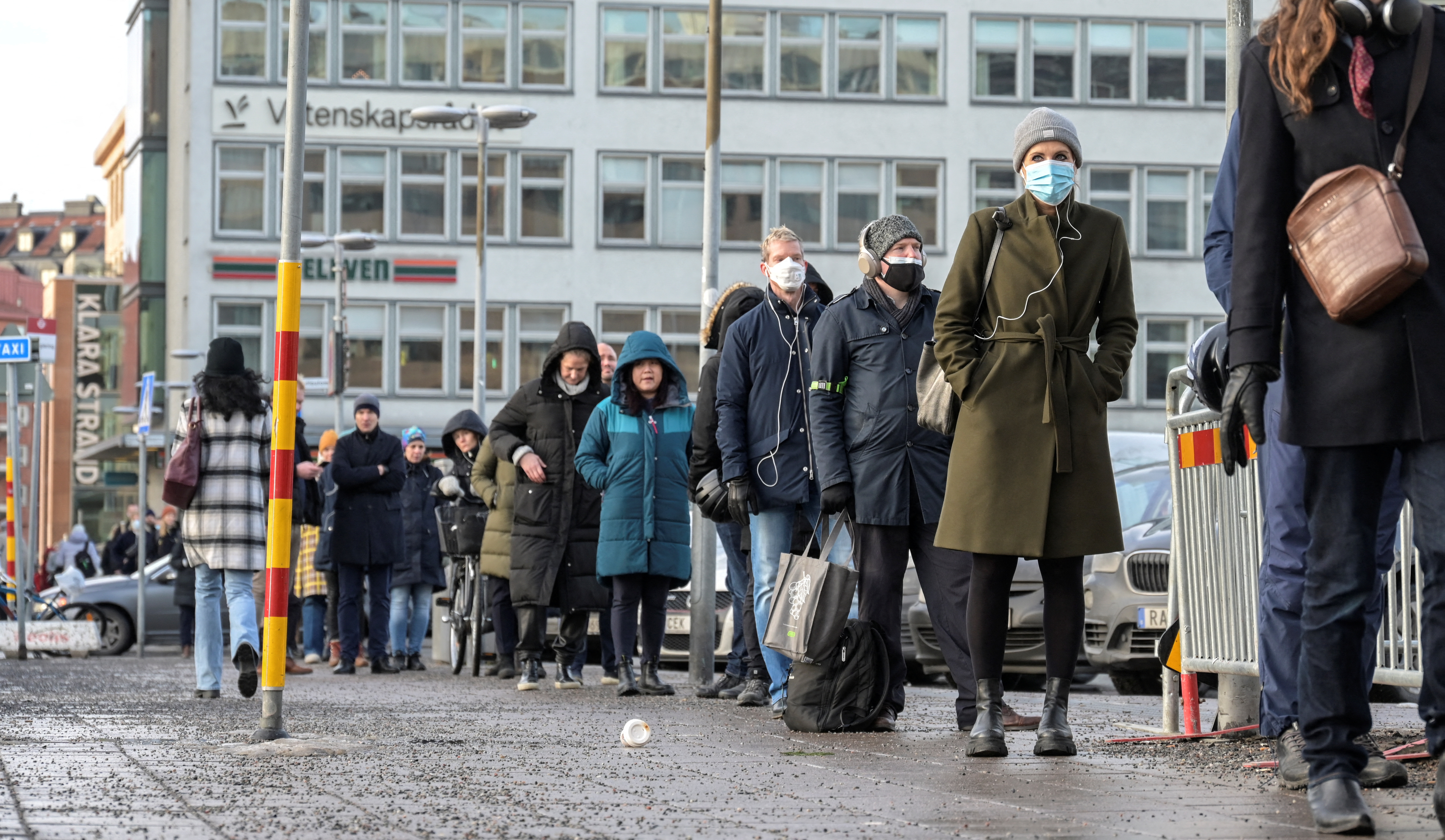 People queue for a drop-in vaccination at Stockholm City Terminal station