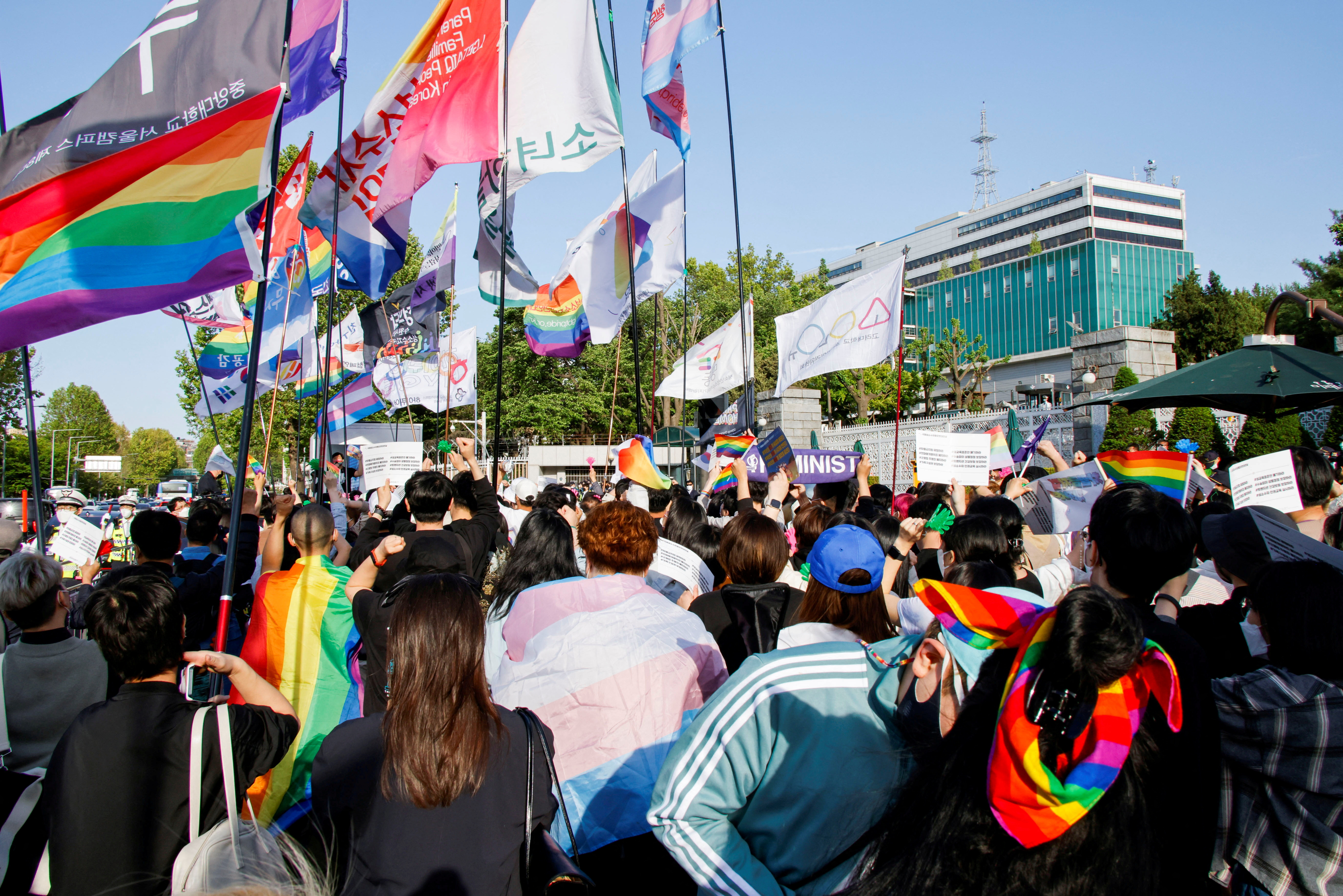 Members of the LGBTQ+ community march in front of the new Presidential office during a protest ahead of the International Day Against Homophobia, Transphobia and Biphobia, in Seoul