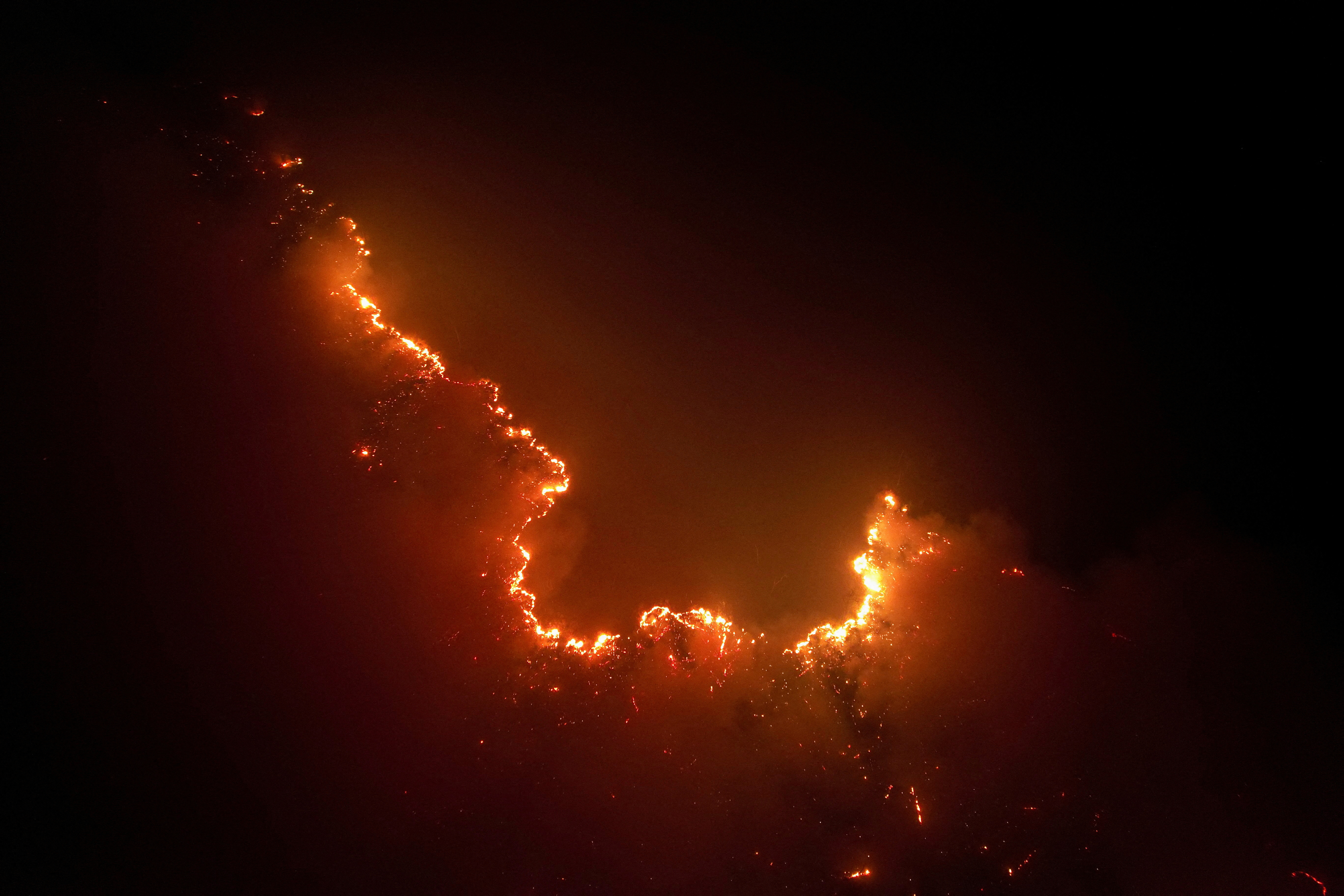 Drone view shows a fire from burning vegetation in Amazon rainforest in Apui