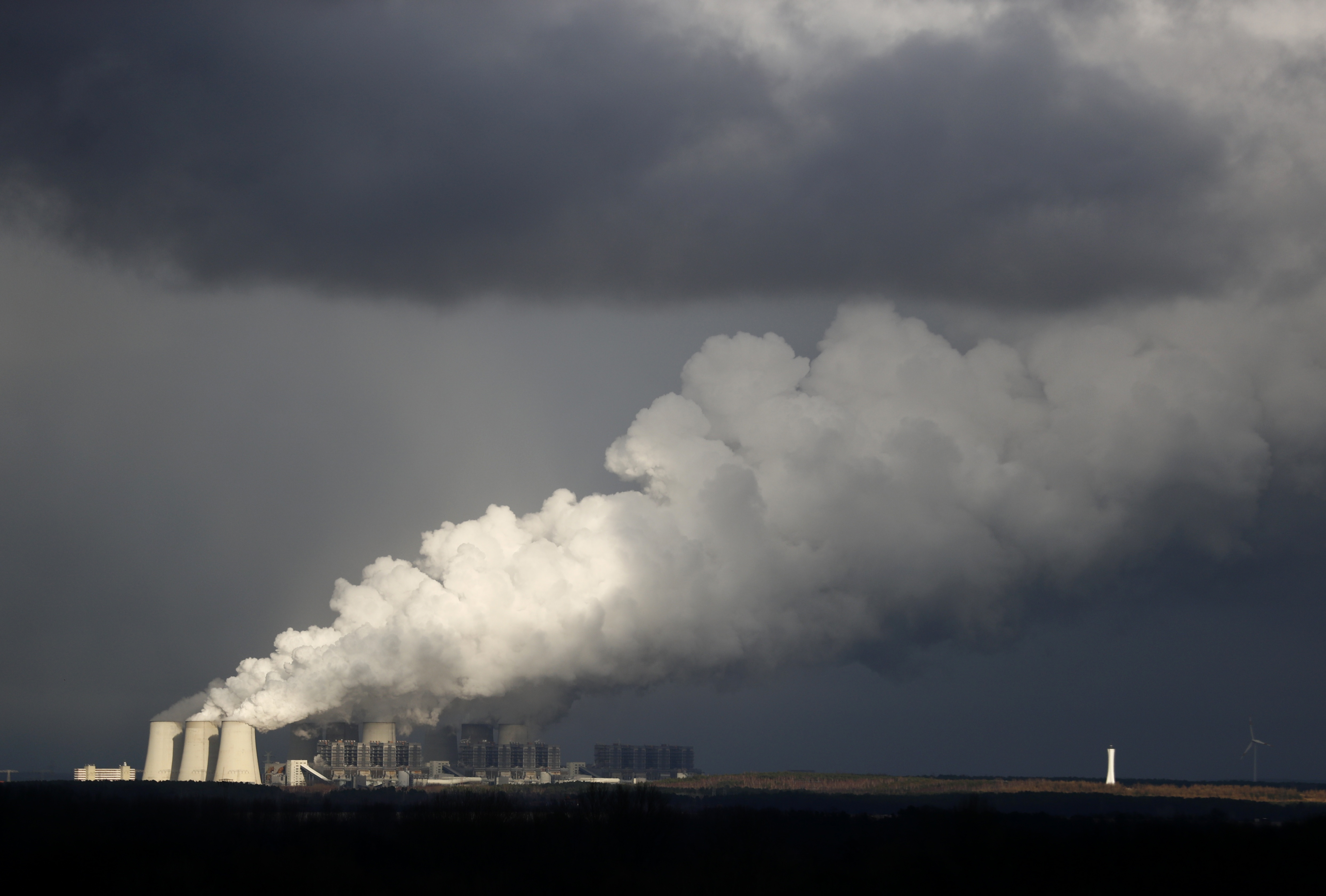 Smoke rises from the coal power plant in Jaenschwalde