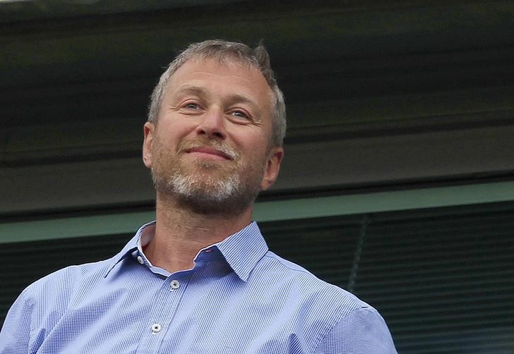 Chelsea owner Roman Abramovich watches the players do a lap of honour after their English Premier League soccer match against Blackburn Rovers in London