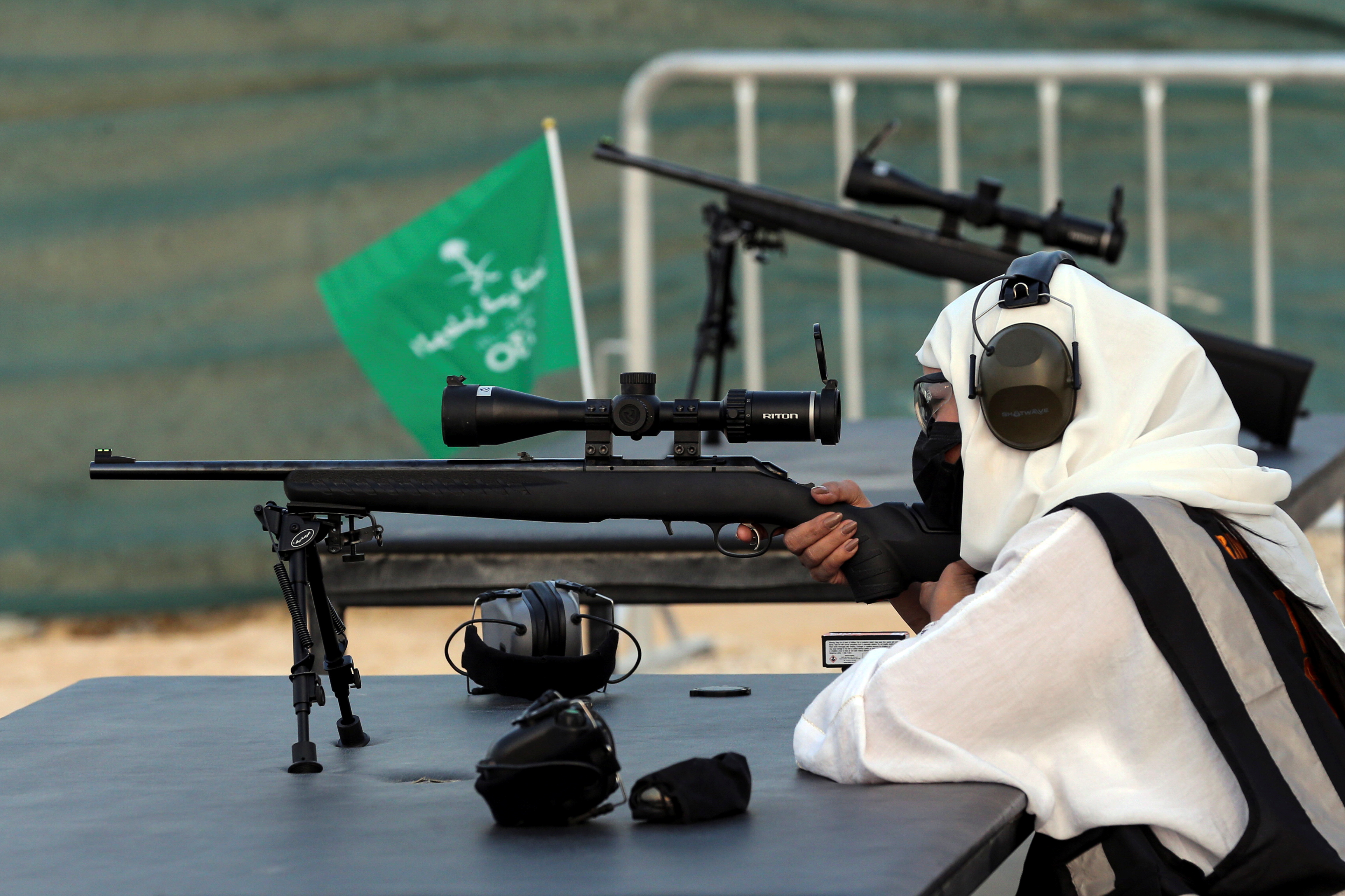 Saudi female firearm trainer, Mona Al Khurais, takes aim with her long-range rifle during her target practice at the Top-Gun shooting range in Riyadh, Saudi Arabia, October 28, 2021. REUTERS/Ahmed Yosri