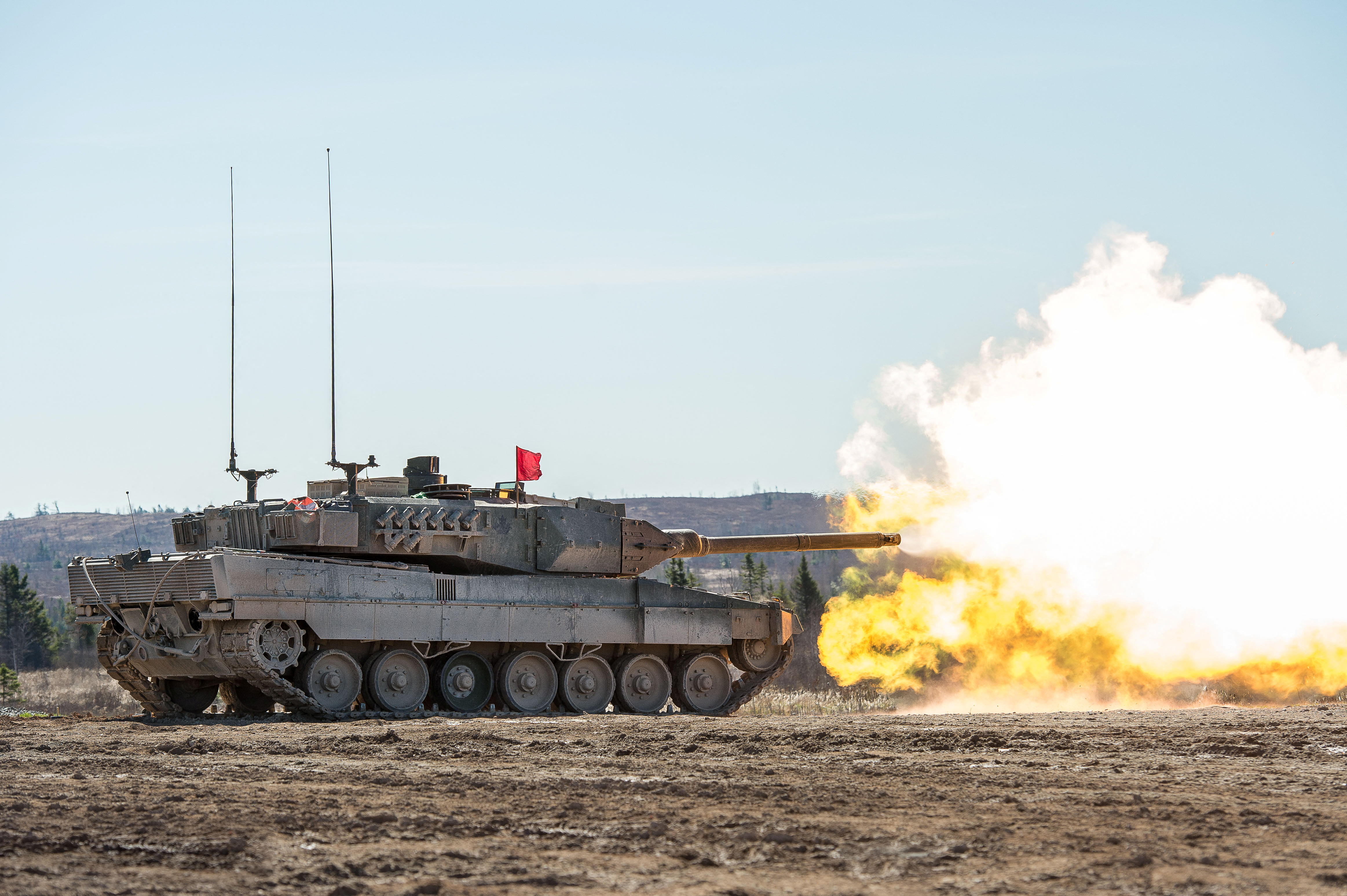 Members of the Royal Canadian Armoured Corps School (RCACS) practice their shooting skills from a Leopard II tank at firing point 4 in the training areas at the 5th Canadian Division Support Group (5 CDSG) Gagetown, in Oromocto