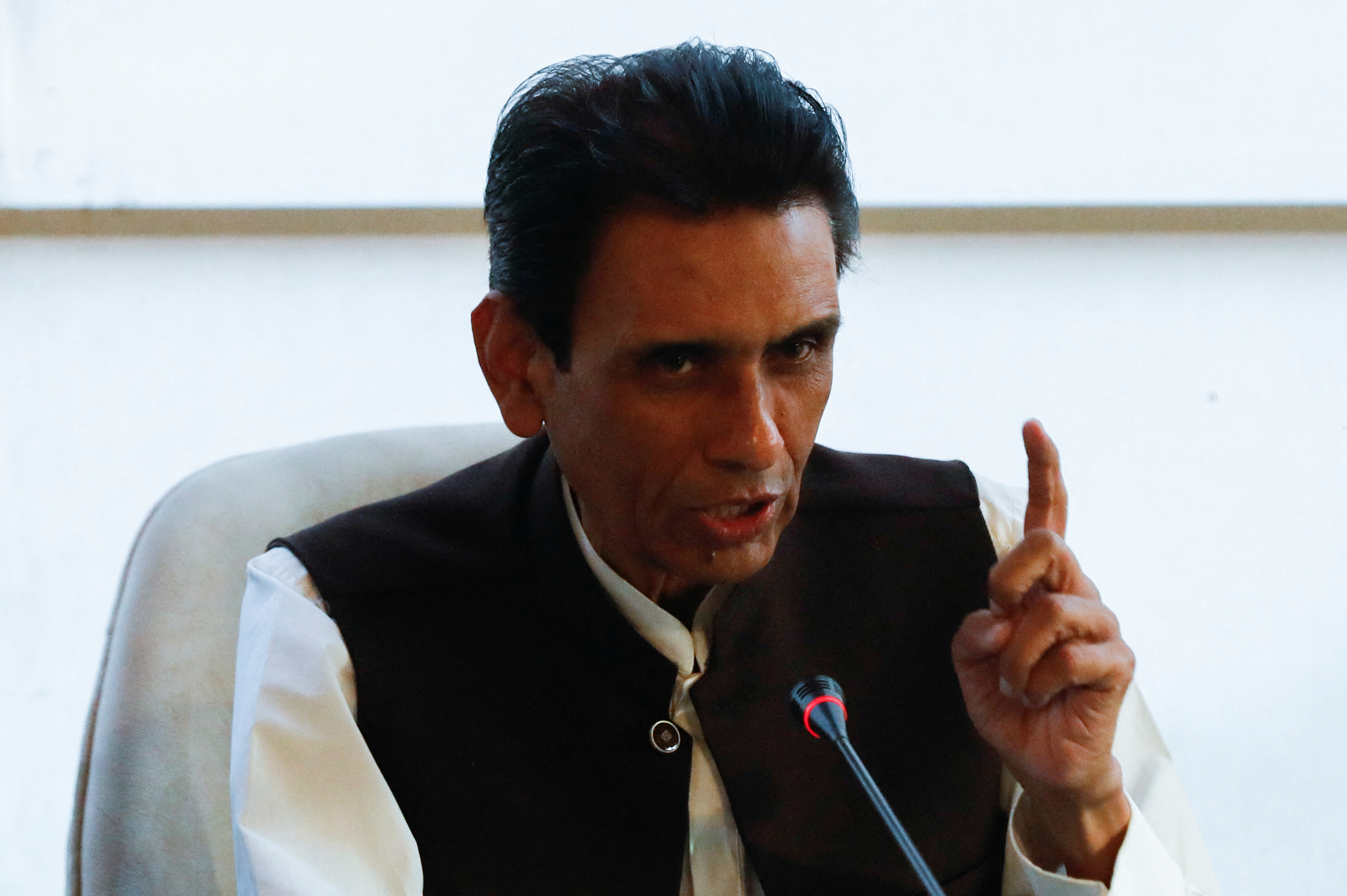 Khalid Maqbool Siddiqui, leader of the Muttahida Qaumi Movement political party, gestures during a joint press conference in Islamabad
