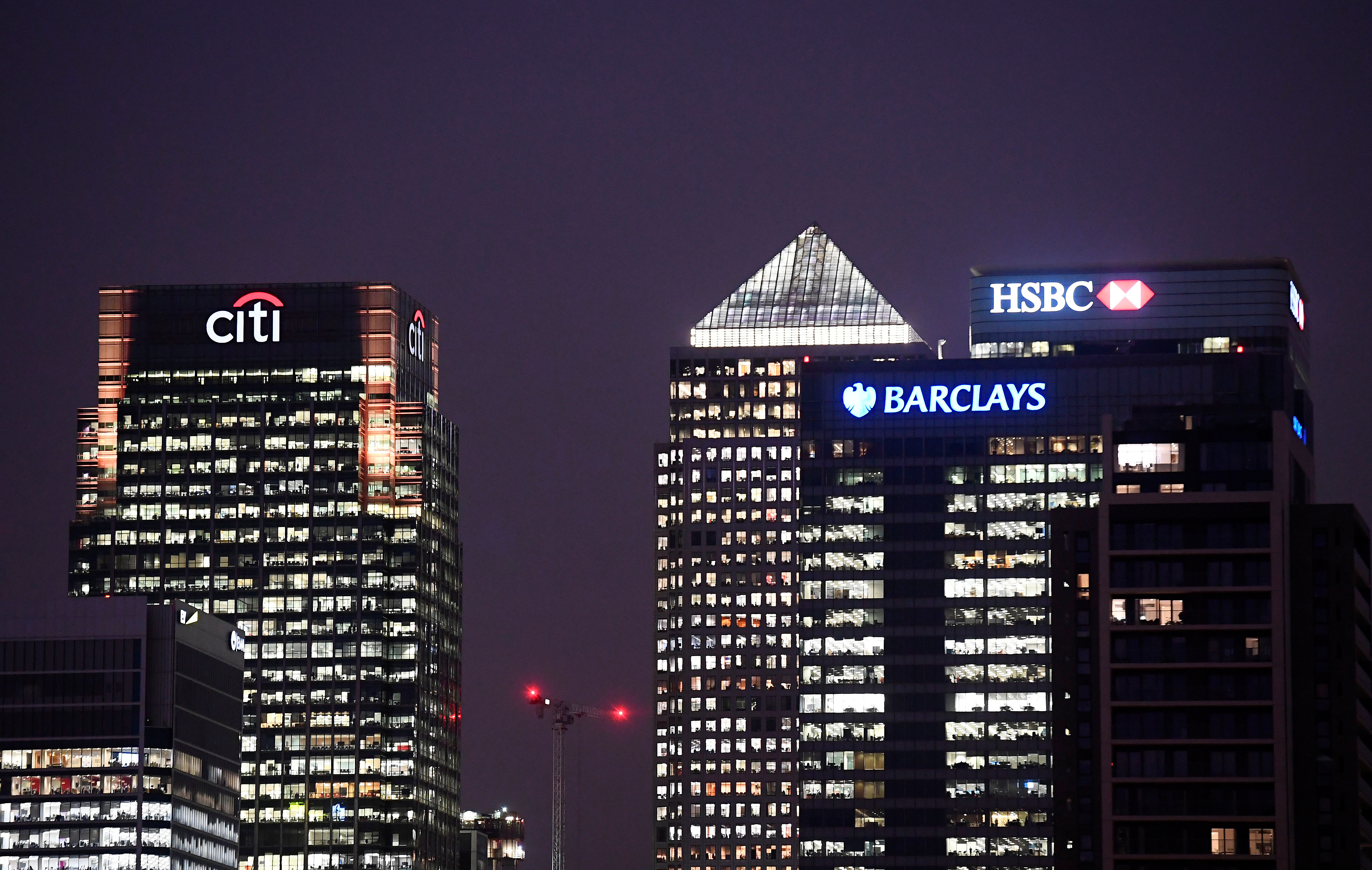 Office blocks of Citi, Barclays, and HSBC banks are seen at dusk in the Canary Wharf financial district in London,