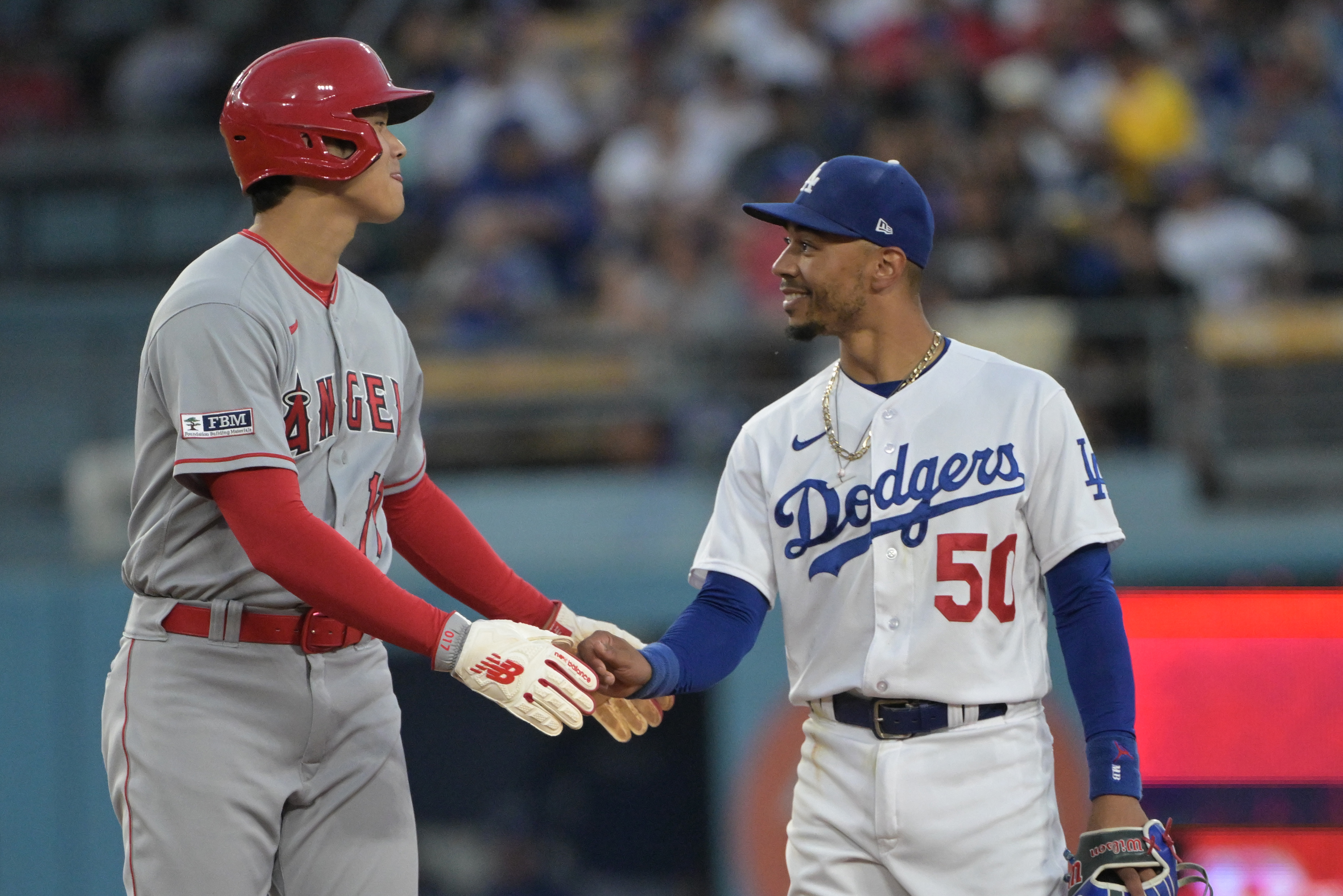 LOS ANGELES, CA - JULY 05 :Los Angeles Dodgers Mookie Betts (50) celebrates  his home run in the third inning against the Colorado Rockies at Dodger  Stadium on July 5, 2022 in