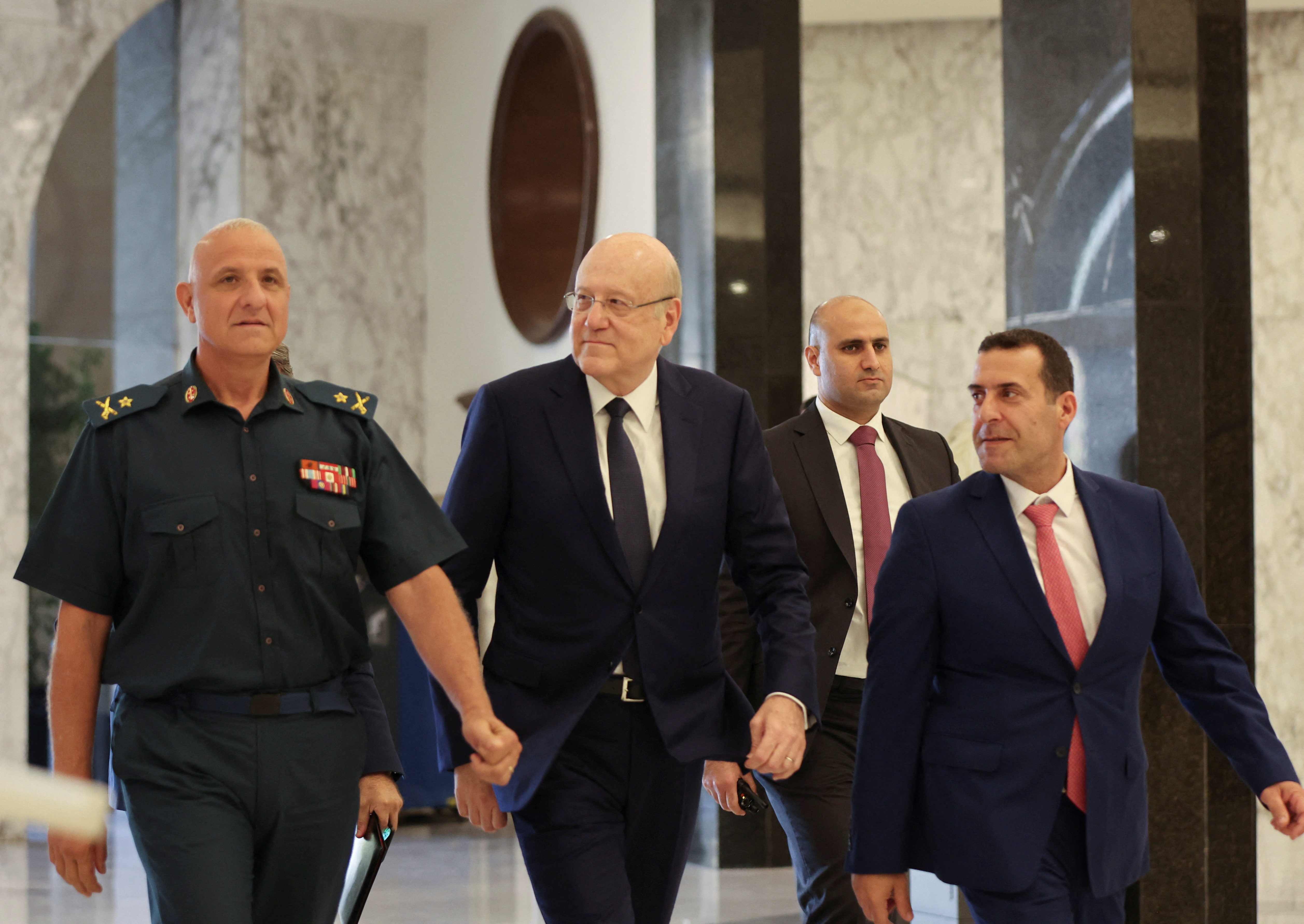 Lebanon's caretaker Prime Minister Najib Mikati arrives at the presidential palace in Baadba