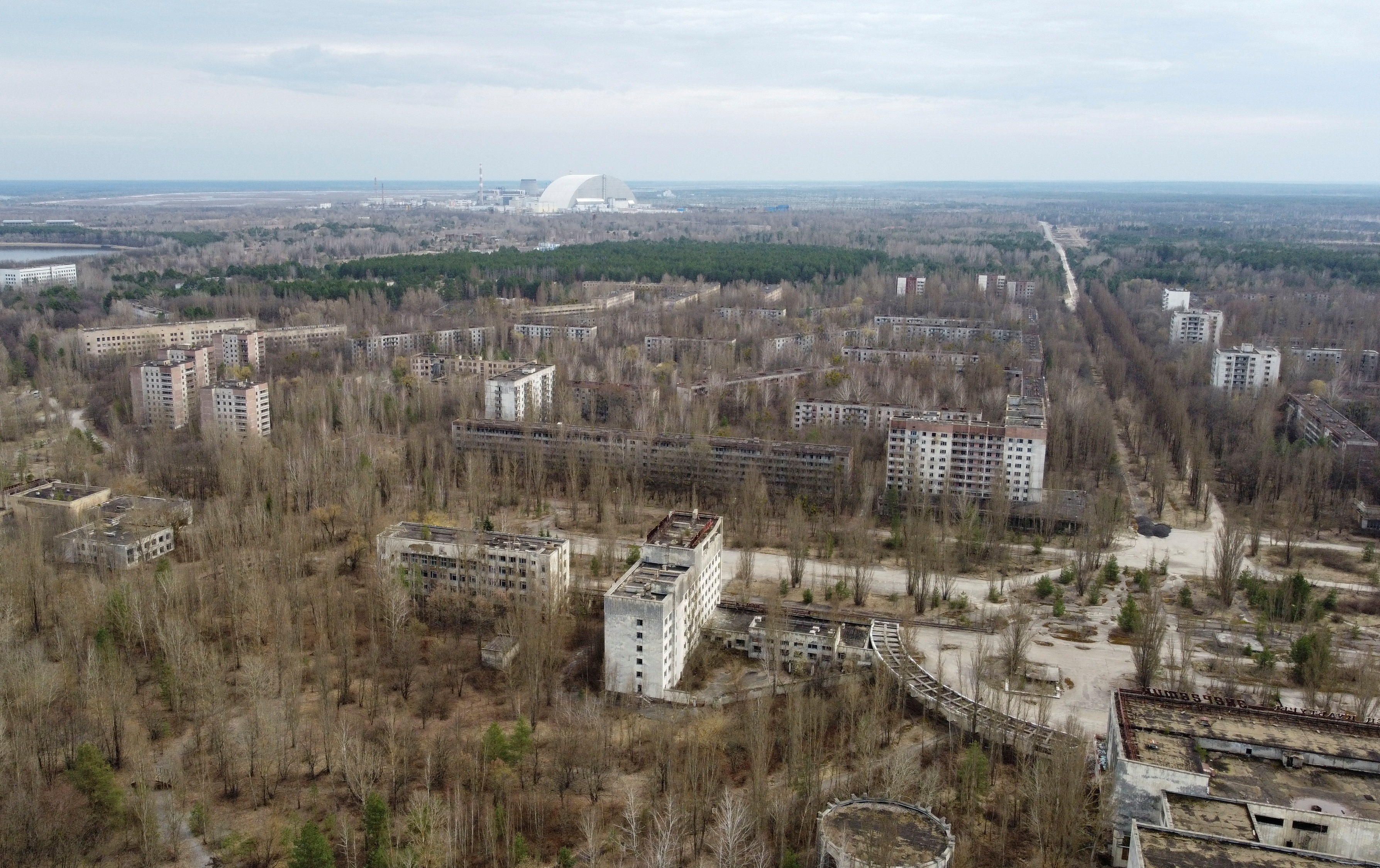 A New Safe Confinement structure at the Chernobyl Nuclear Power Plant is seen behind the abandoned town of Pripyat