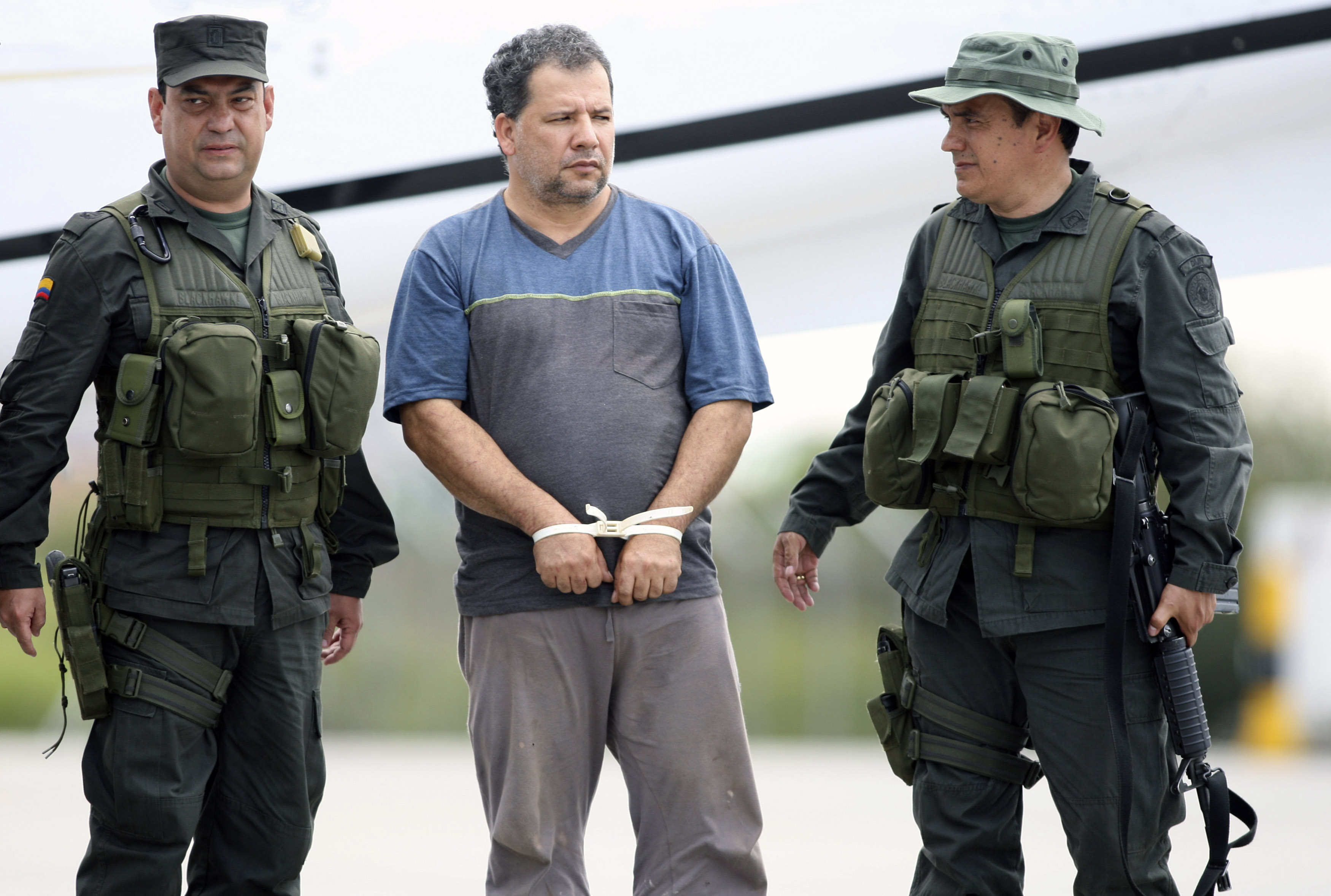 Colombian National Police escort drug lord Rendon Herrera at the military airport of Catam in Bogota