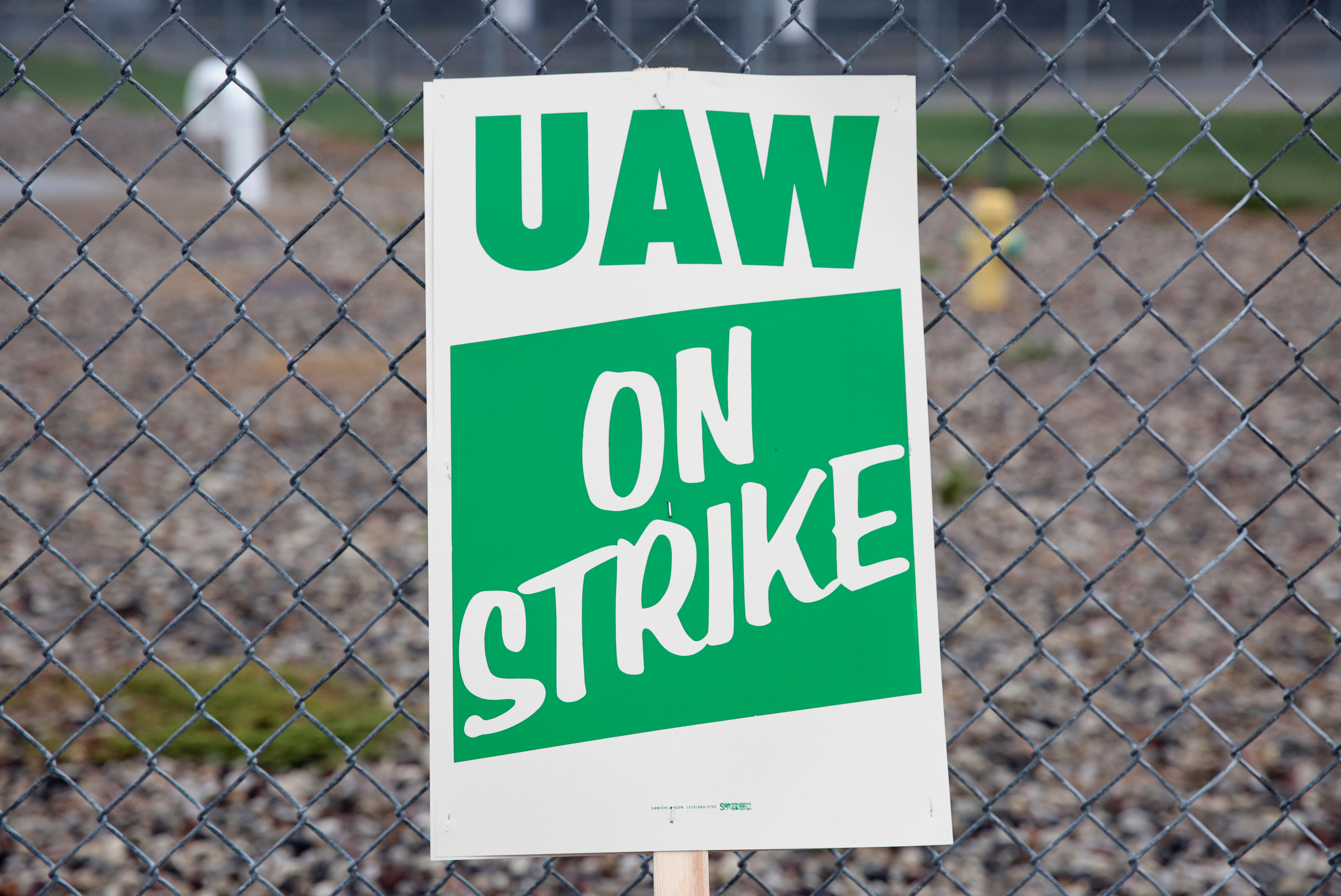 A United Auto Workers (UAW) picket sign is seen outside General Motors Powertrain Flint Engine plant during the UAW national strike in Flint
