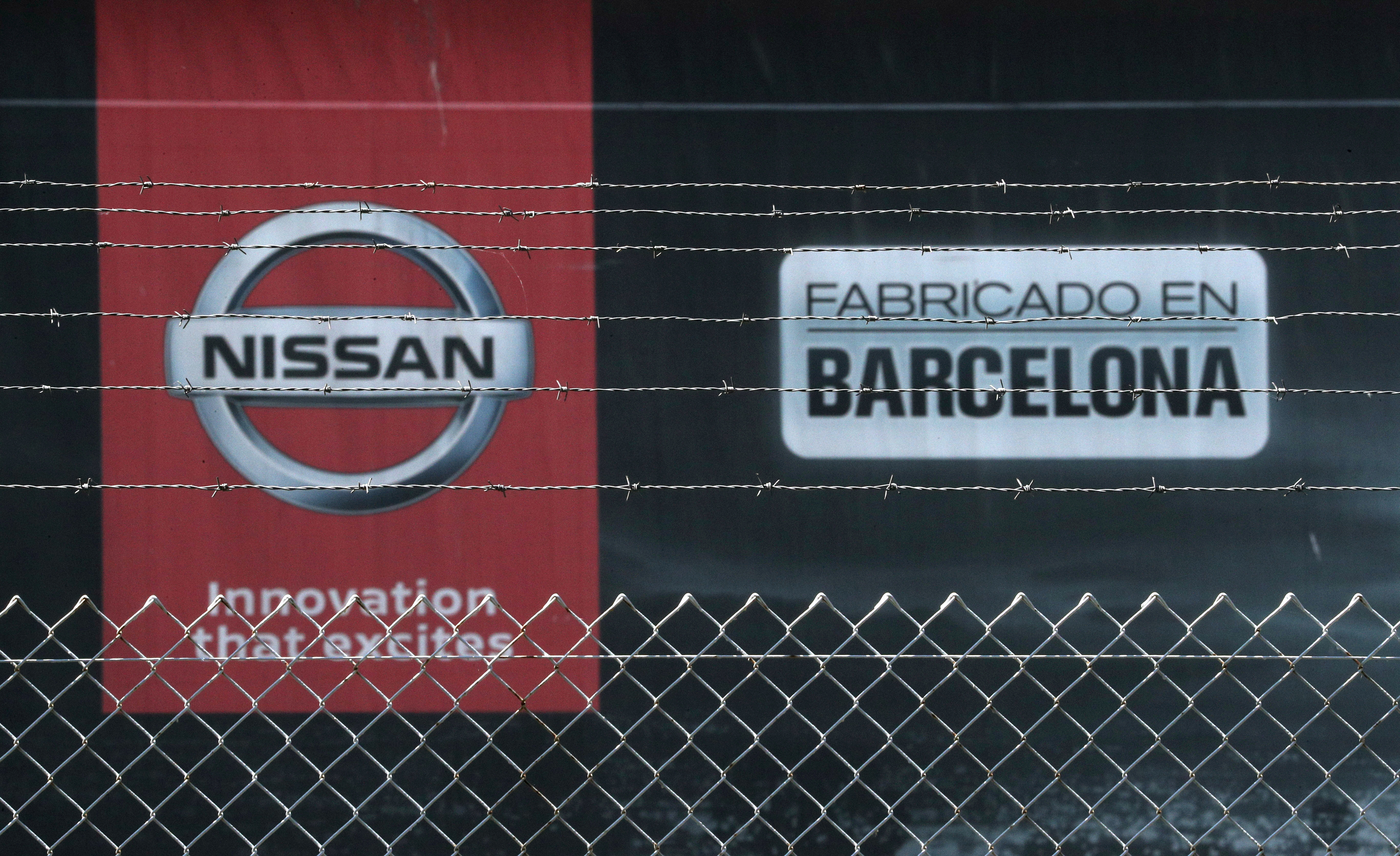 The logo of Nissan is seen through a fence at Nissan factory at Zona Franca during the coronavirus disease (COVID-19) outbreak in Barcelona
