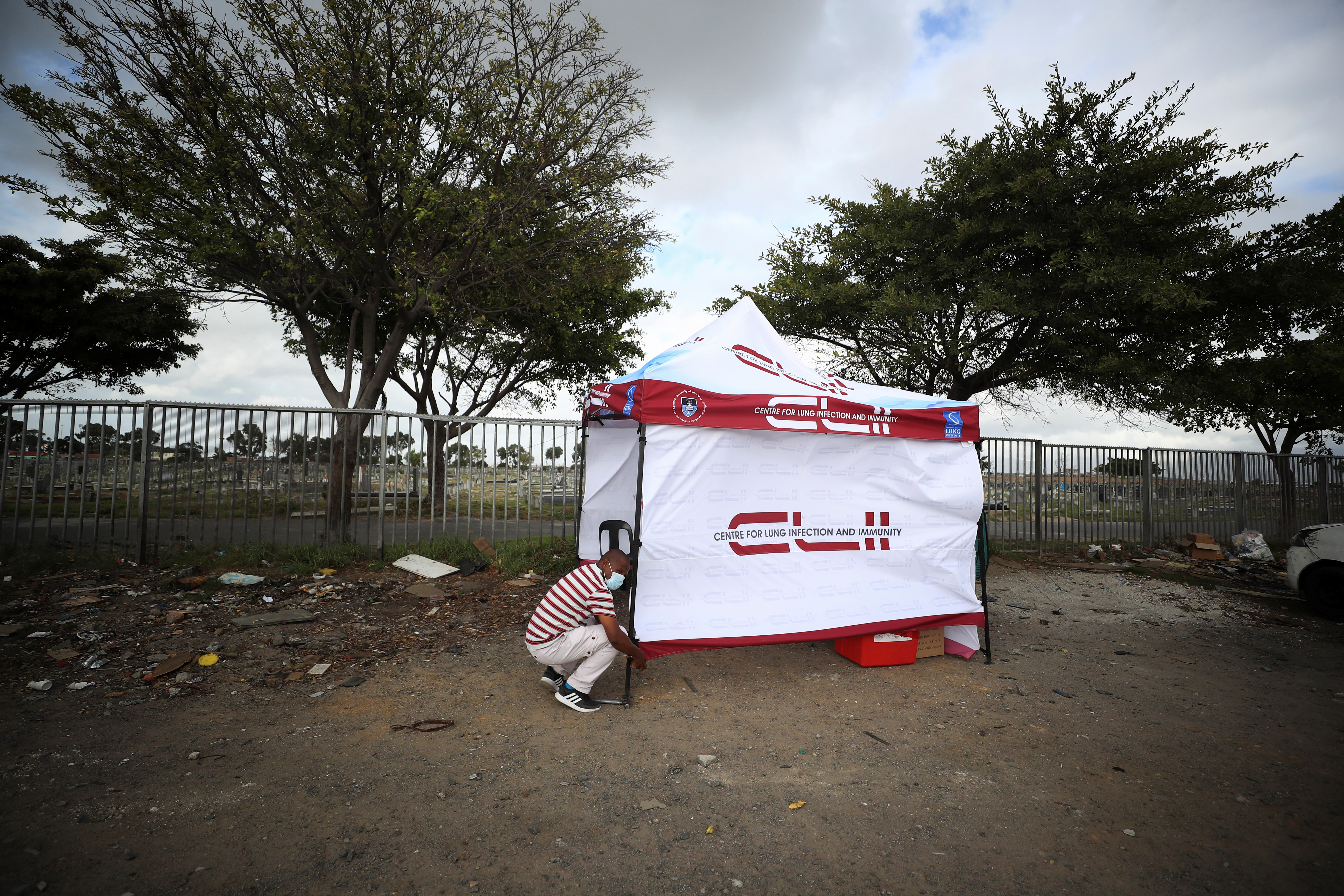 A healthcare worker sets up a mobile clinic in Gugulethu township near Cape Town