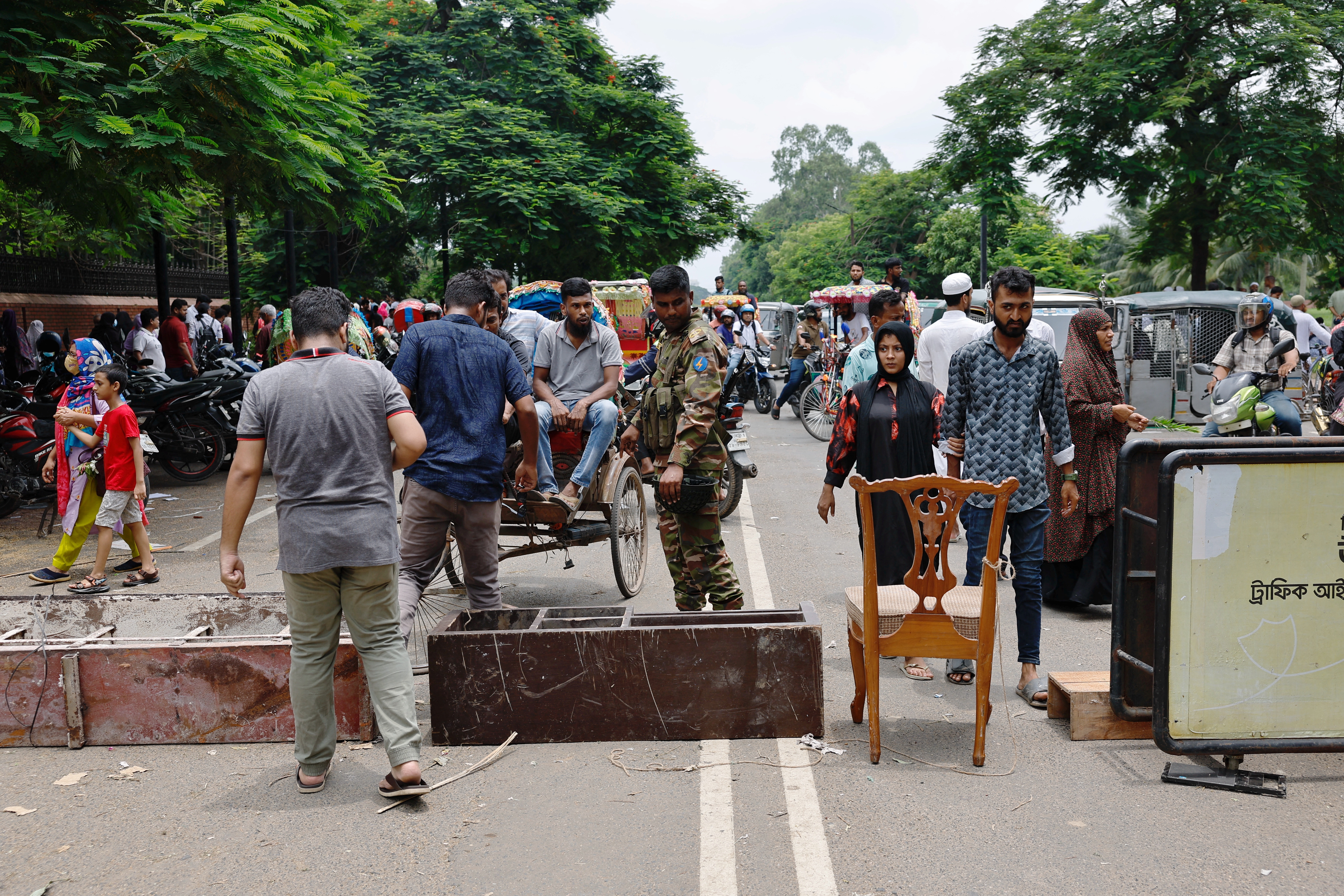 Army member blocks a road at the entrance of the Ganabhaban after Bangladeshi PM Hasina’s resignation in Dhaka