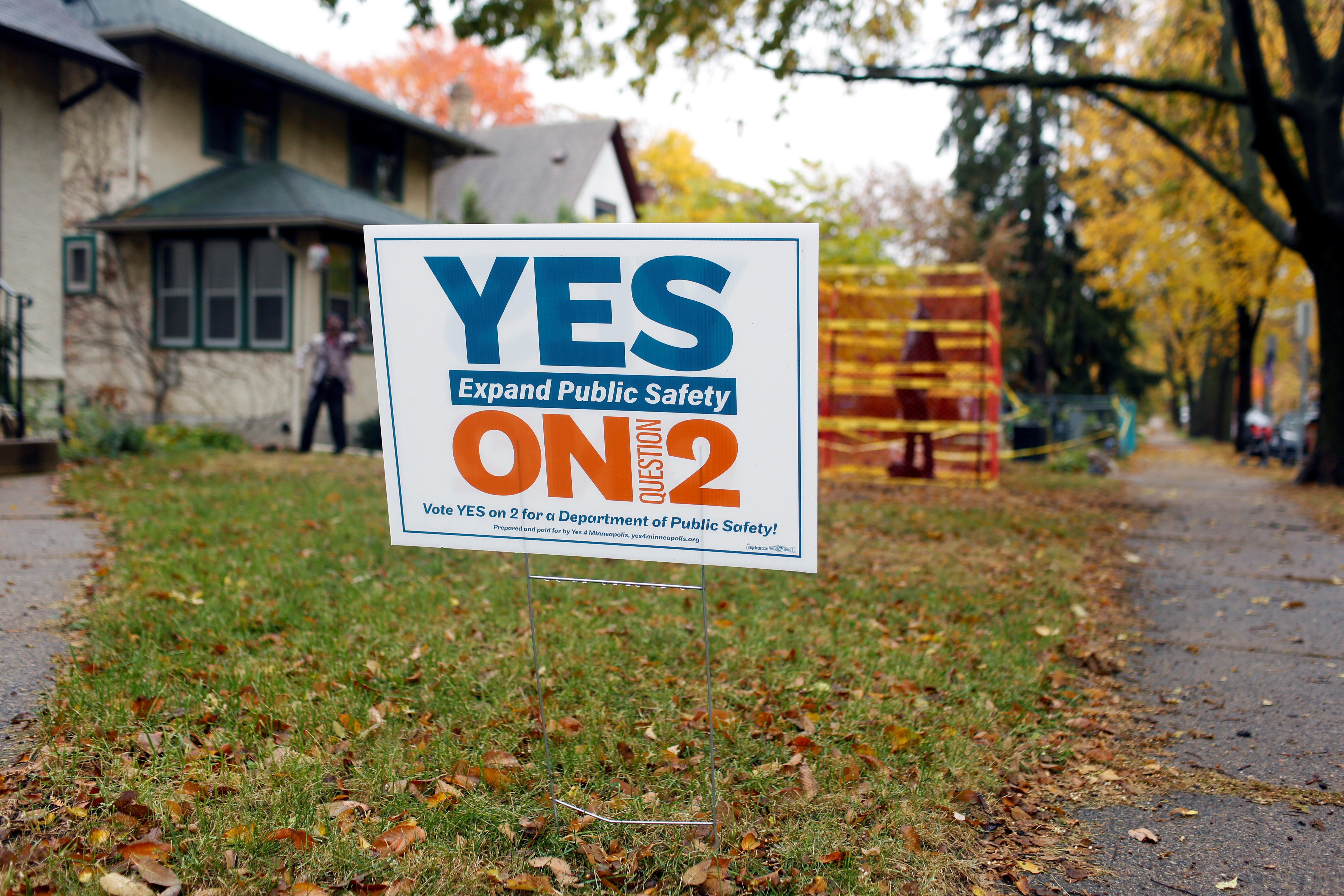 A “Yes on 2” yard sign stands in a front yard ahead of the November 2nd vote on the future of the police department in Minneapolis, Minnesota, U.S., October 28, 2021. Picture taken October 28, 2021.  REUTERS/Nicole Neri