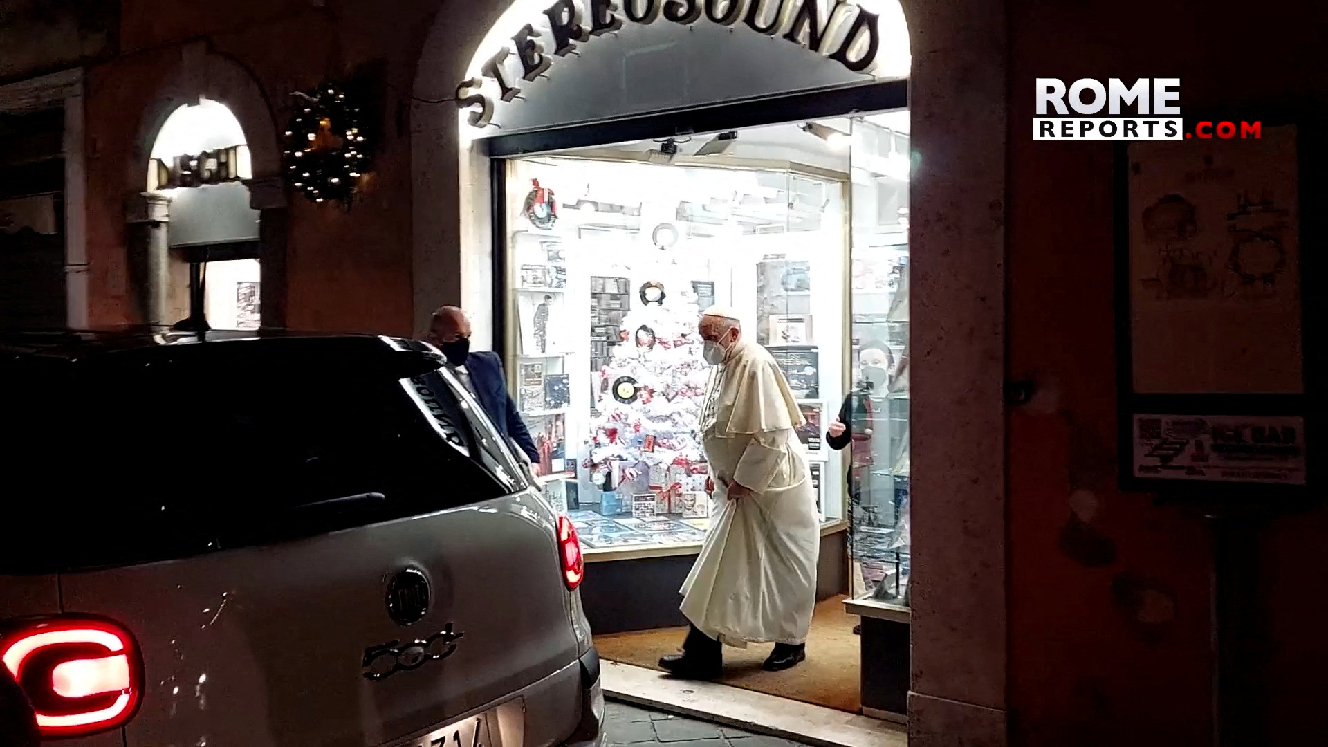 A screenshot taken from a video shows Pope Francis walking out of a record store in Rome, Italy, on January 11, 2022. The video was taken on January 11, 2022. Rome reports / delivery via REUTERS 