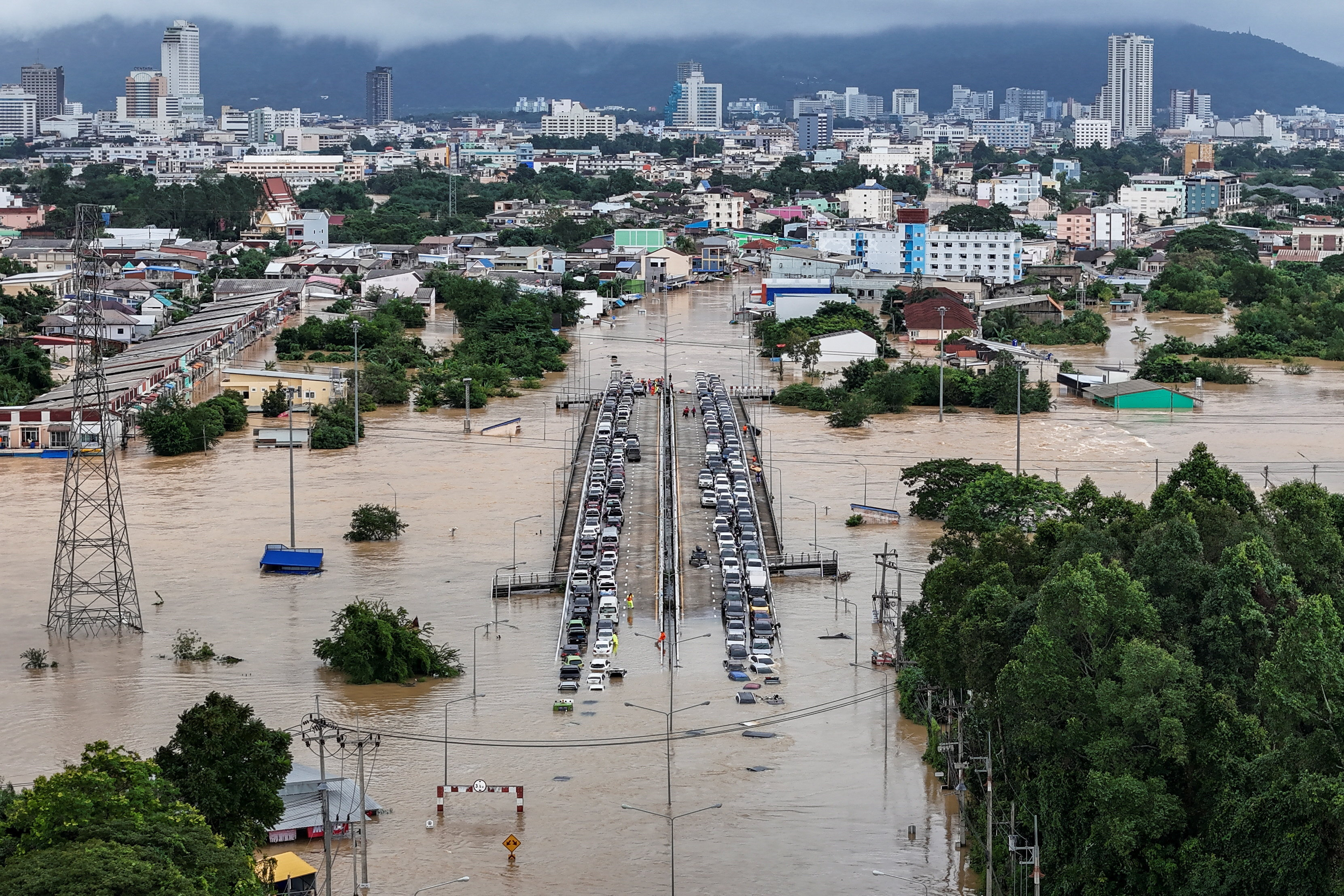 Thai military takes charge of flood crisis as heavy rains hobble relief  effort | Reuters