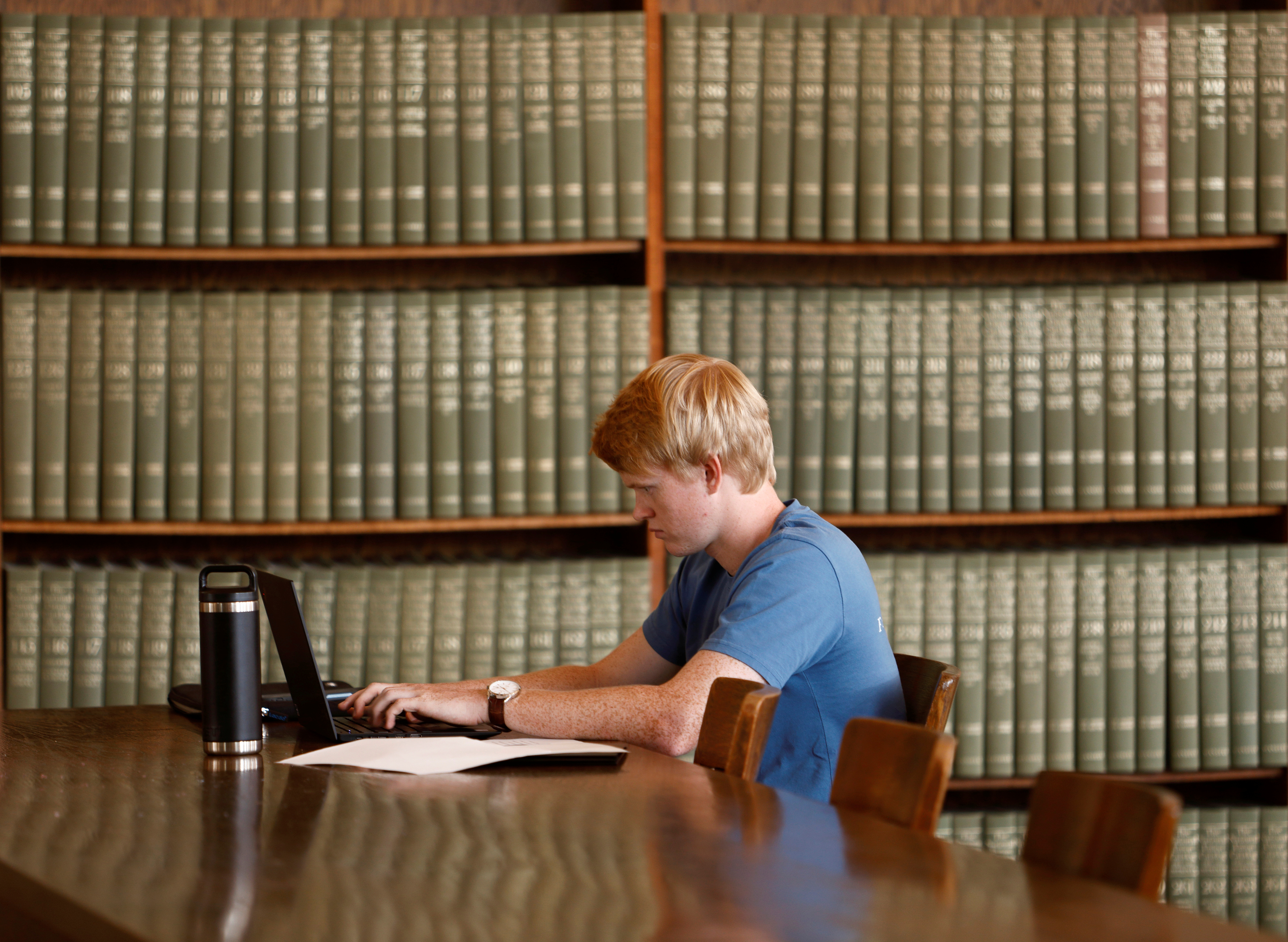 A student works in Wilson Library on the campus of the University of North Carolina at Chapel Hill, North Carolina