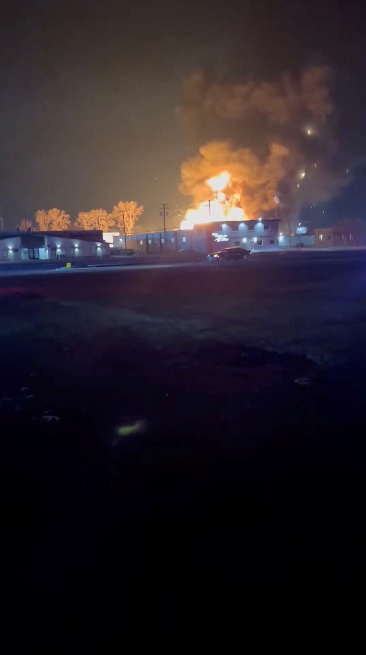 Smoke and flames rise at an industrial site in Clinton Township, Michigan