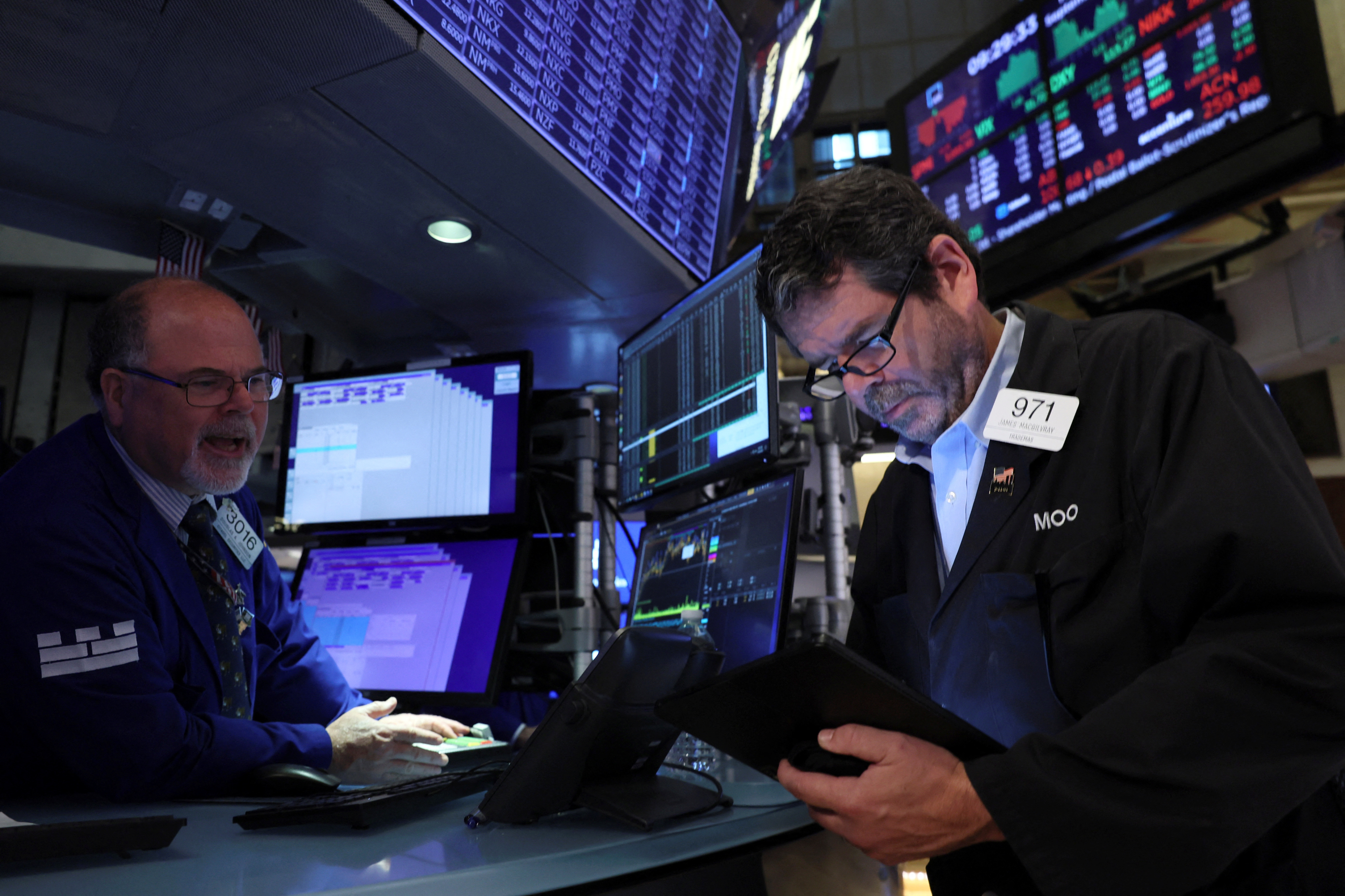 Traders work on the floor of the New York Stock Exchange in New York
