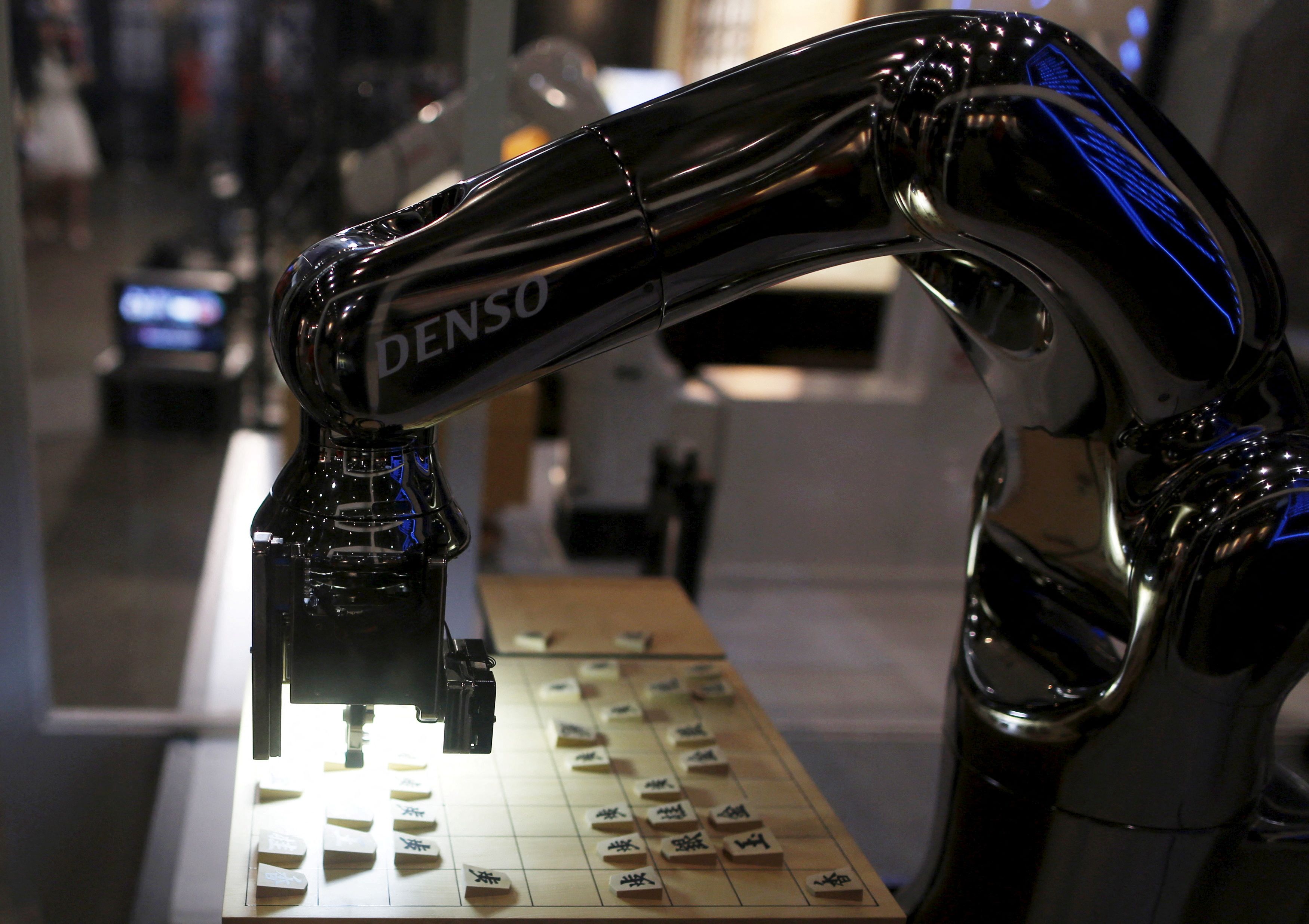 Denso Corp's robot arm "Denoute-san" plays Japanese chess, also known as Shogi, at a booth during Niconico Chokaigi 2015 in Makuhari