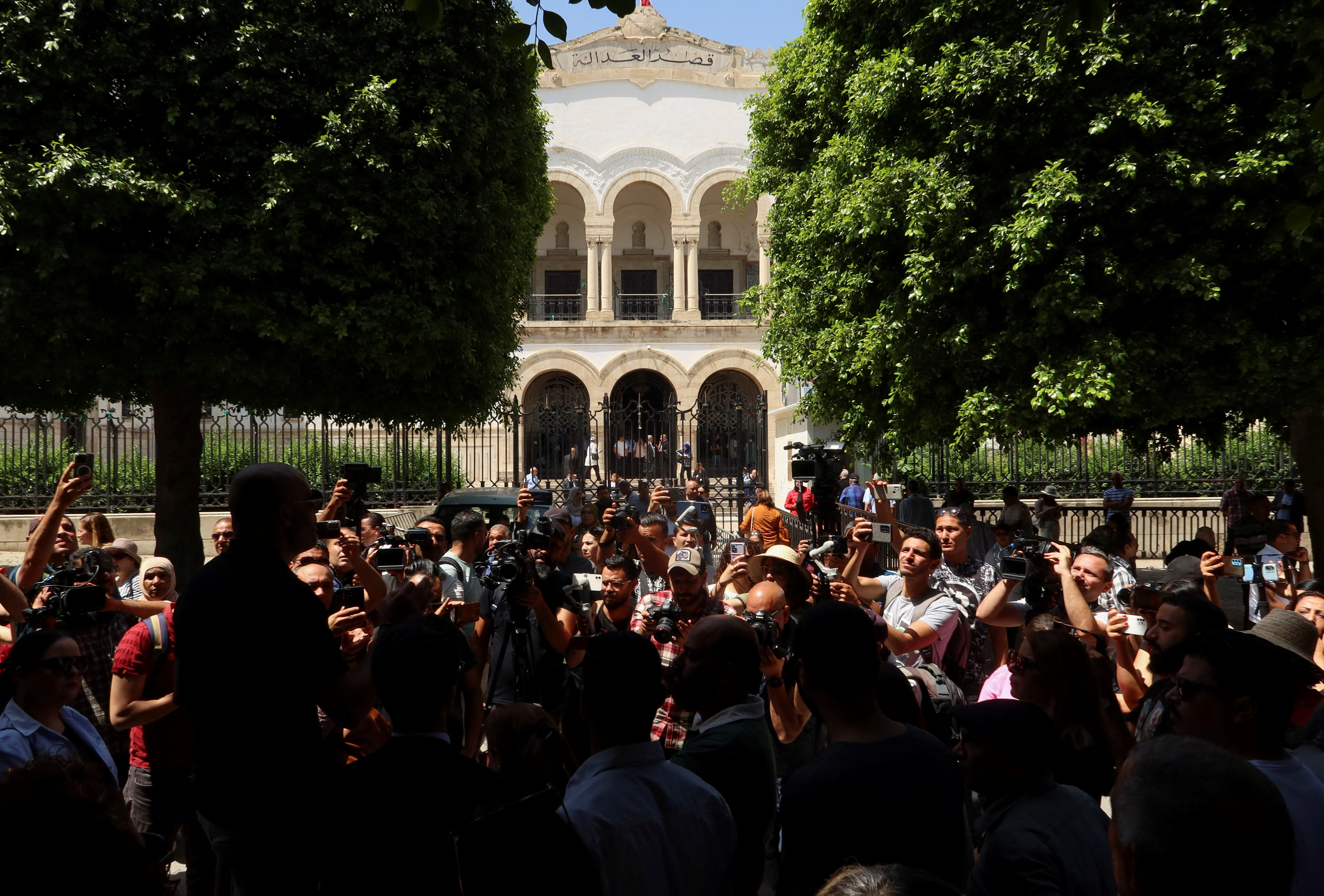 Journalists protest outside the Palace of Justice in Tunis