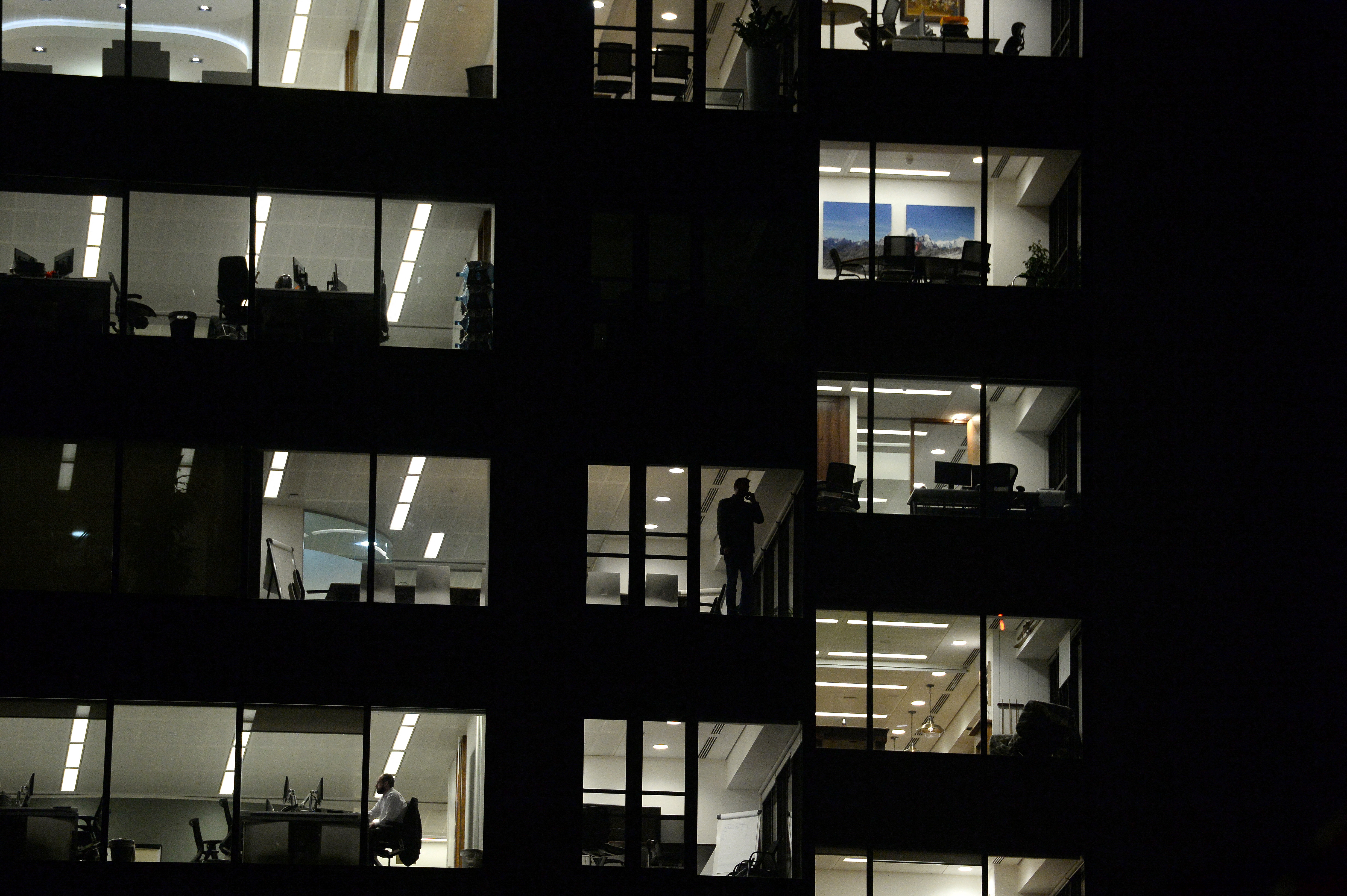 Workers continue working into the night in the City of London