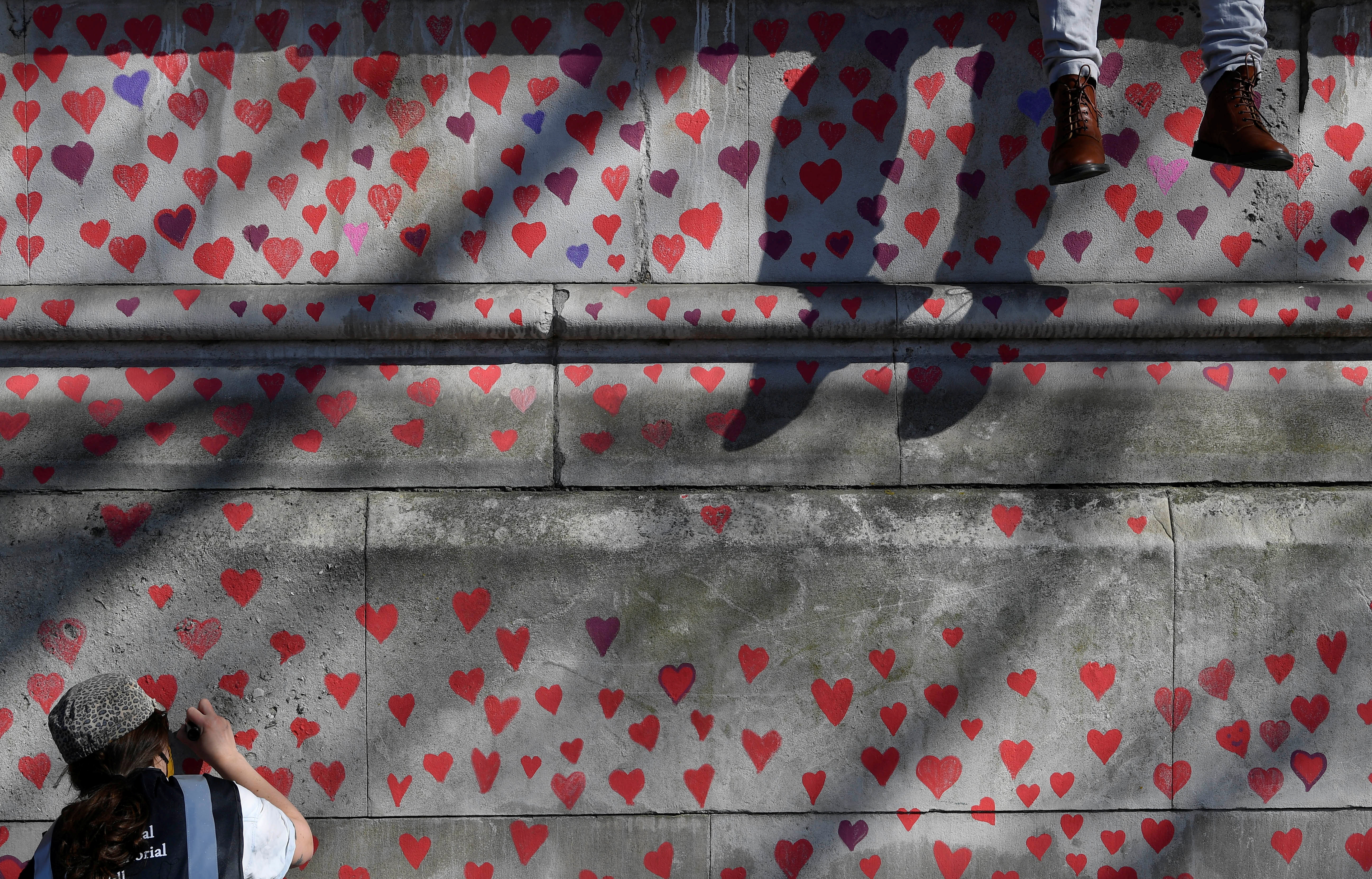 Red Hearts On Wall by By Jérémie Lusseau