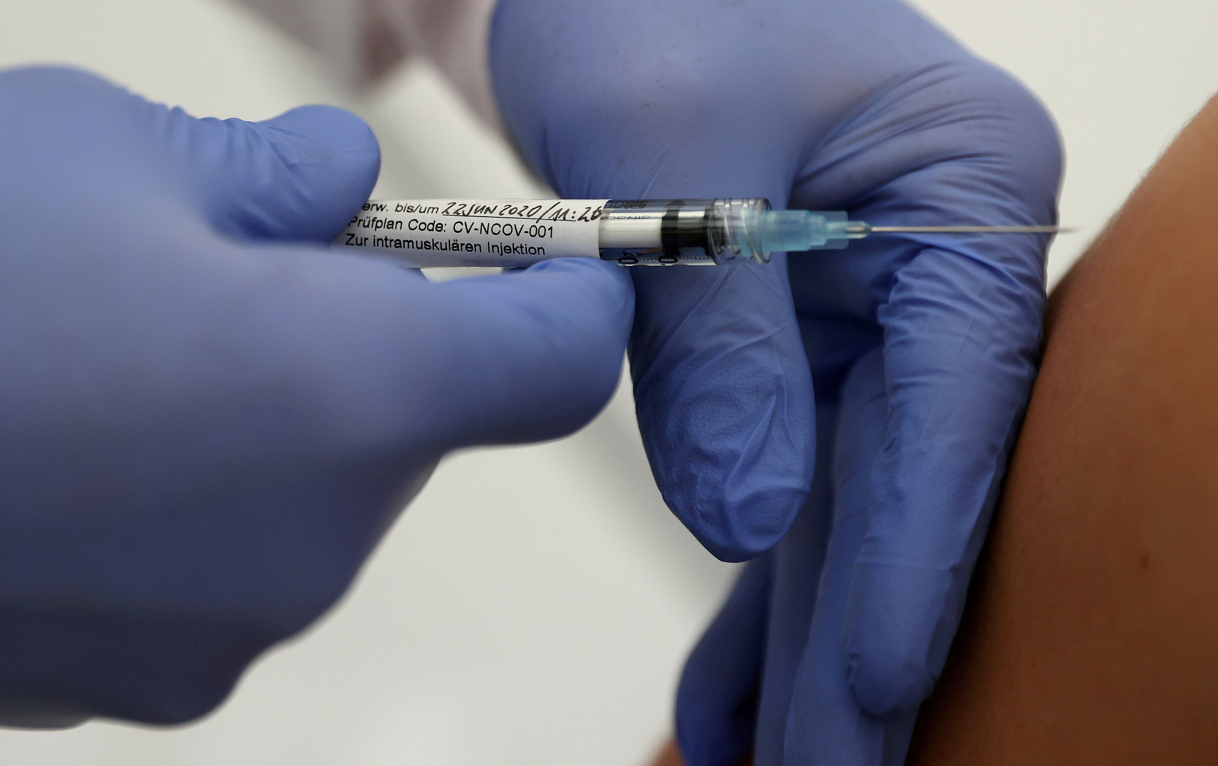 German biotechnology company CureVac's vaccination against the coronavirus disease (COVID-19) is given to a volunteer at the start of a clinical test series in Tuebingen, Germany, June 22, 2020.   REUTERS/Kai Pfaffenbach
