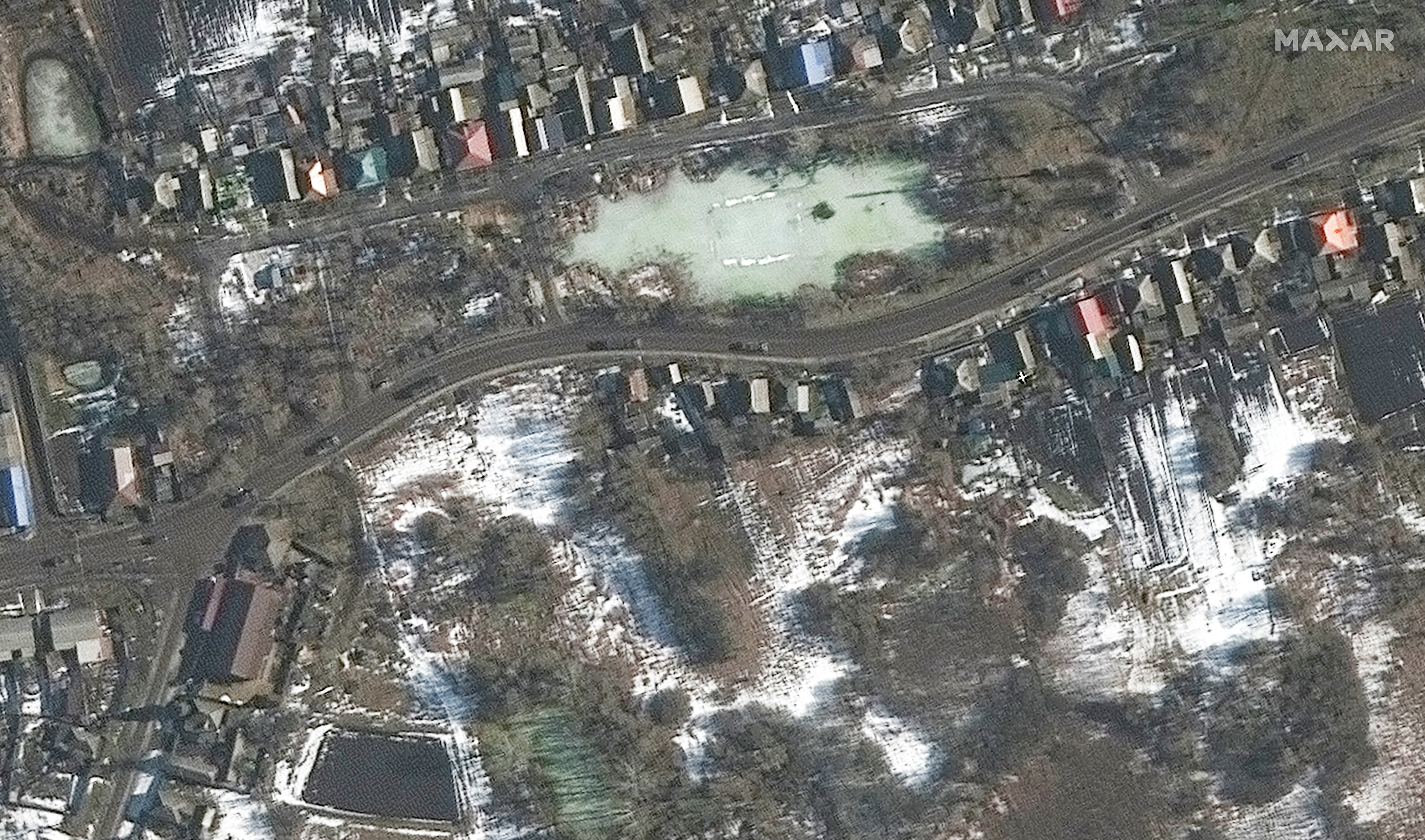 A satellite image shows a military convoy moving south, in Golovchino