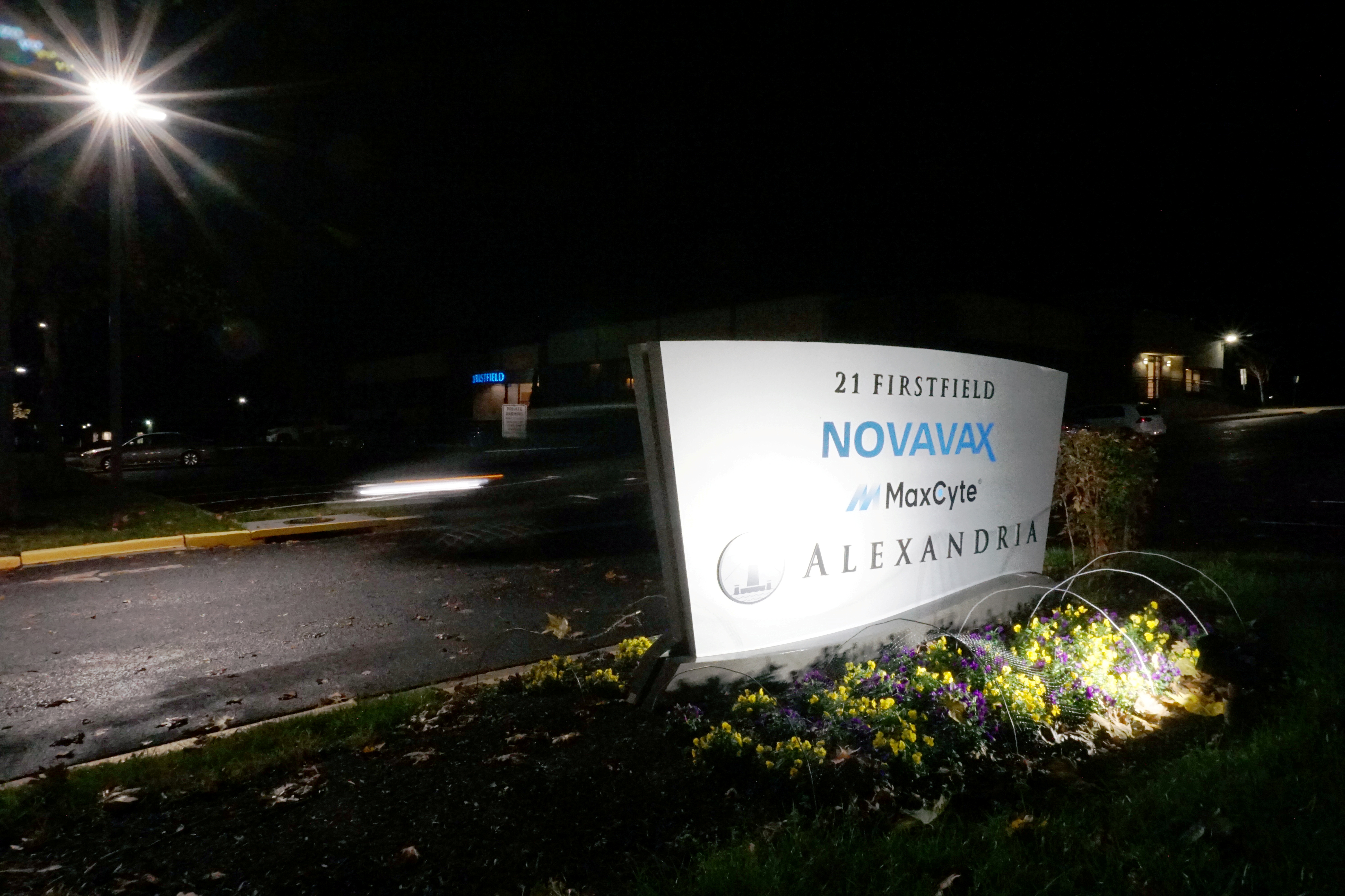 A car drives past the sign for vaccine developer Novavax at the company's headquarters in Gaithersburg, Maryland, November 30, 2020.  REUTERS/Raphael Satter
