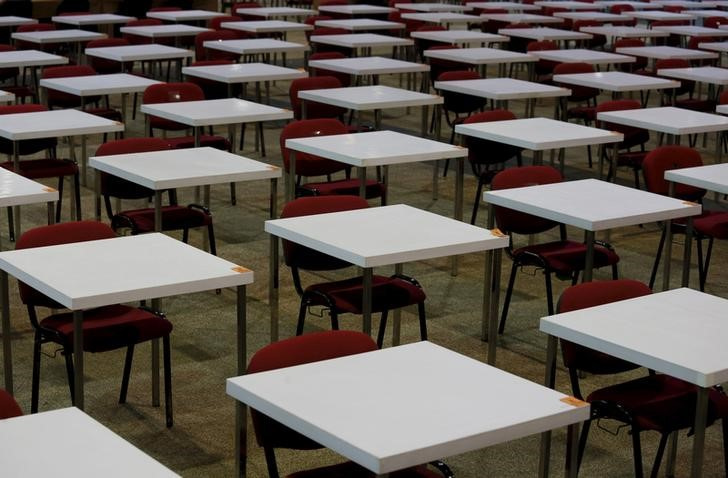 Tables are seen inside a hall in Hong Kong, one day before SAT examinations to be taken place