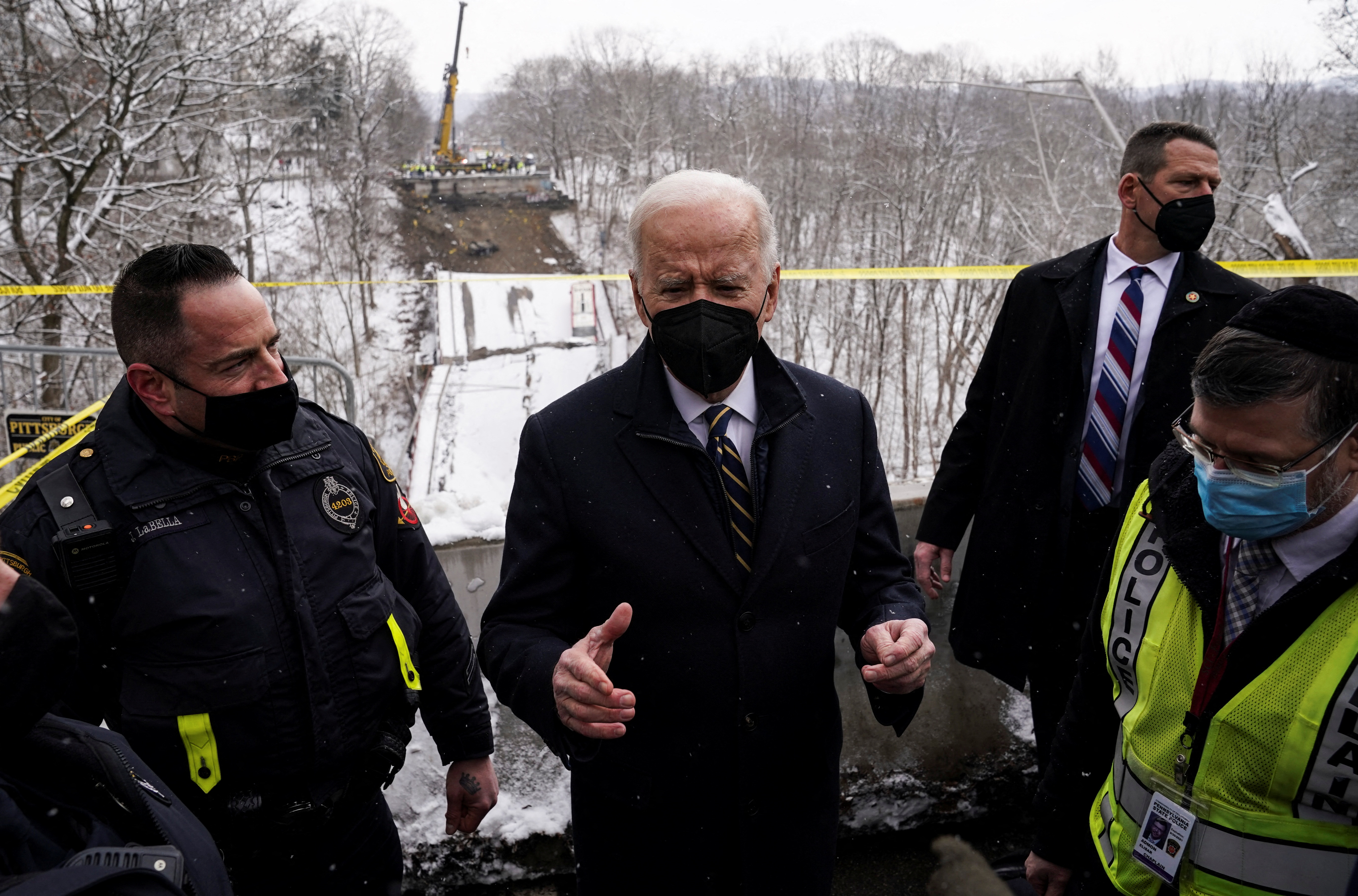 U.S. President Joe Biden speaks to reporters and first responders as he visits the site of a bridge collapse prior to attending an earlier scheduled event in Pittsburgh, Pennsylvania, U.S., January 28, 2022. REUTERS/Kevin Lamarque