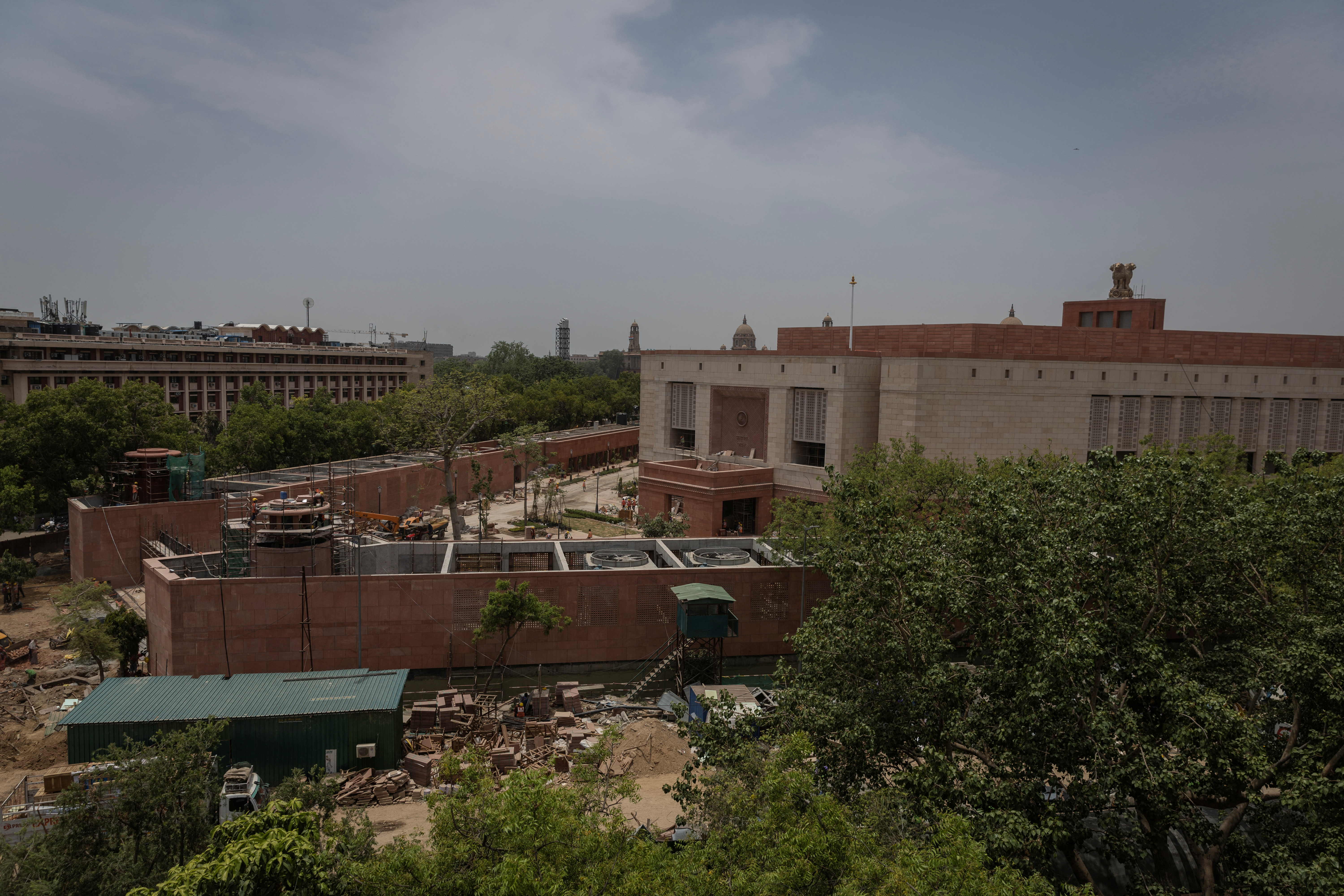 Labourers work at the under construction site of the new parliament building in New Delhi