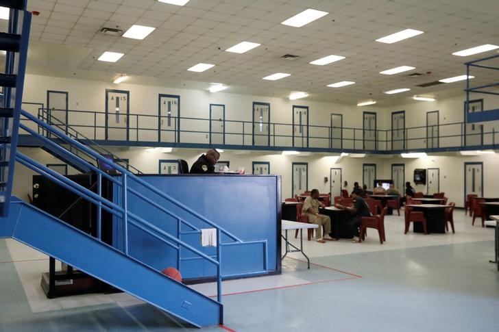 Inmates sit inside a the housing facility for inmates at the Chatham County jail in Savannah, Georgia