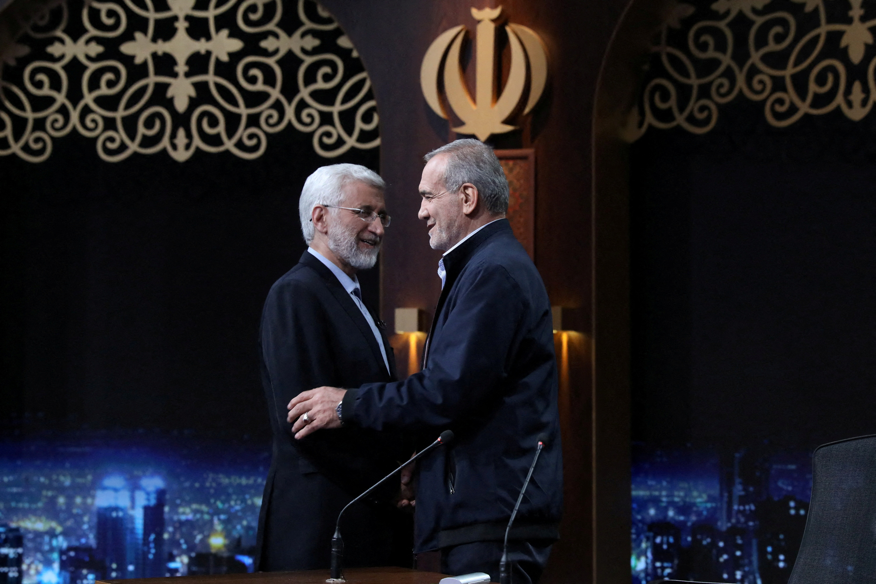 Presidential candidates Masoud Pezeshkian and Saeed Jalili ​attend an election debate, in Tehran