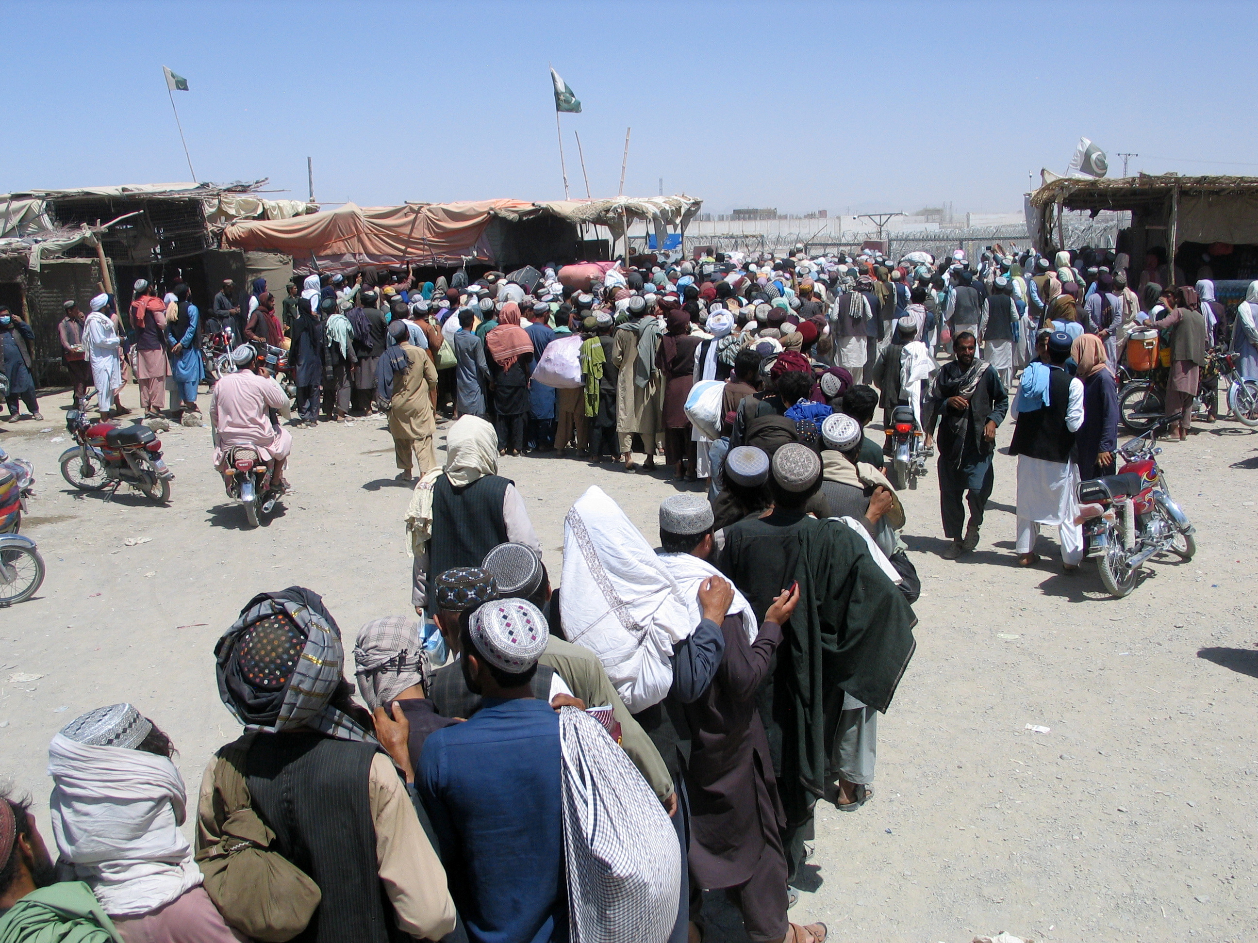 People wait to cross at Friendship Gate at Pakistan-Afghanistan border town of Chaman