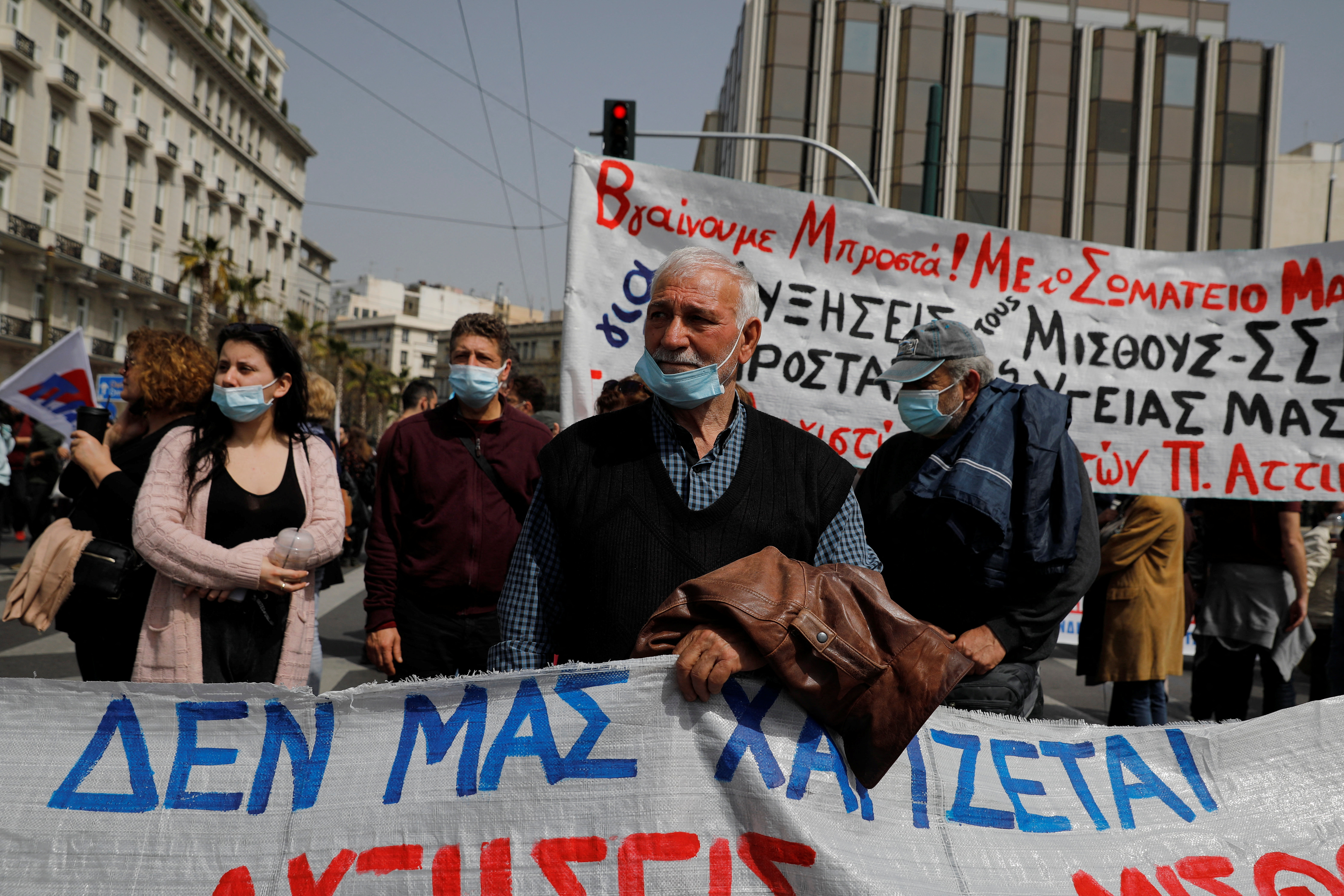 Eurozone crisis live: Thousands protest against Greek