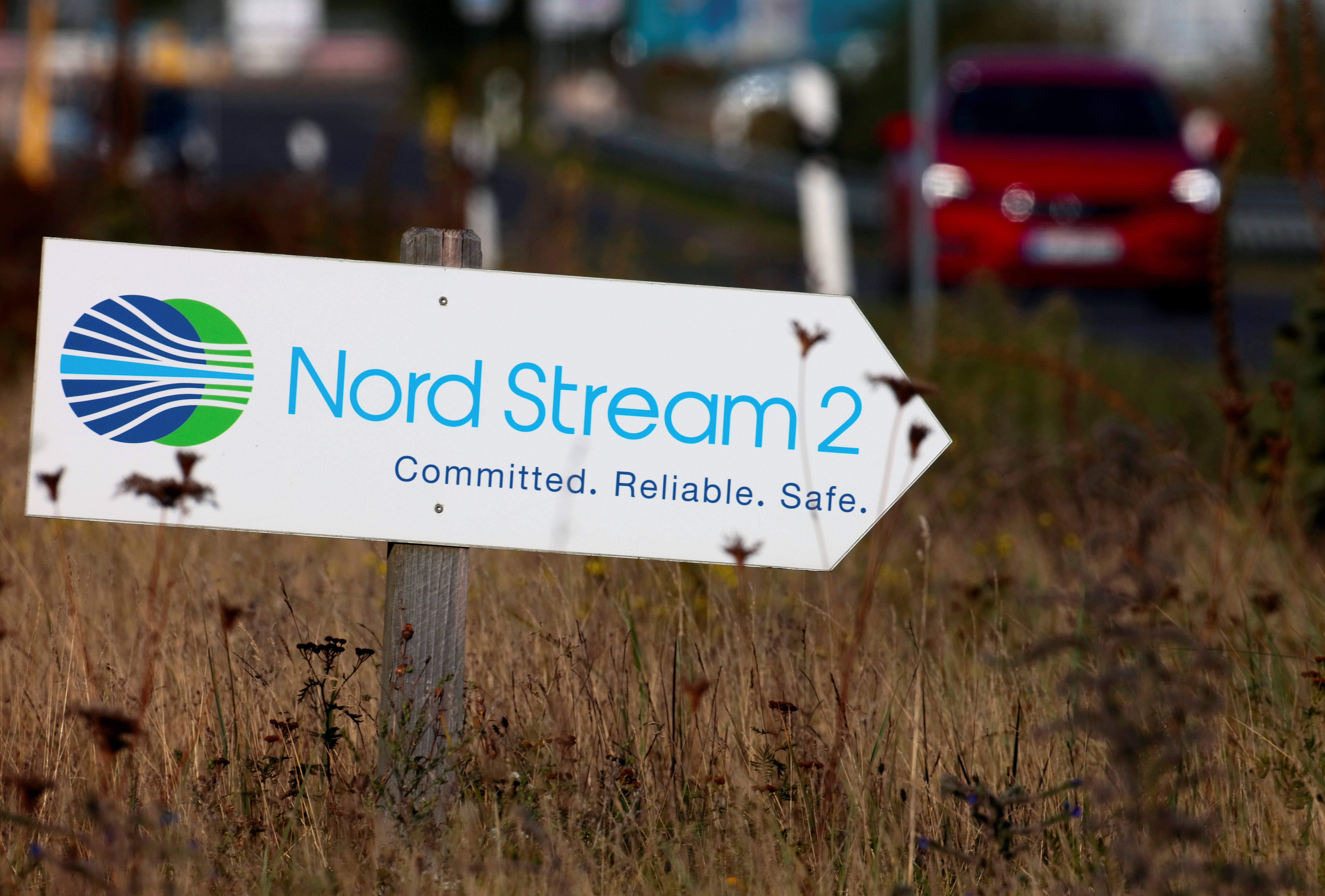 A road sign directs traffic towards the Nord Stream 2 gas line landfall facility entrance in Lubmin, Germany, September 10, 2020. REUTERS/Hannibal Hanschke/File Photo
