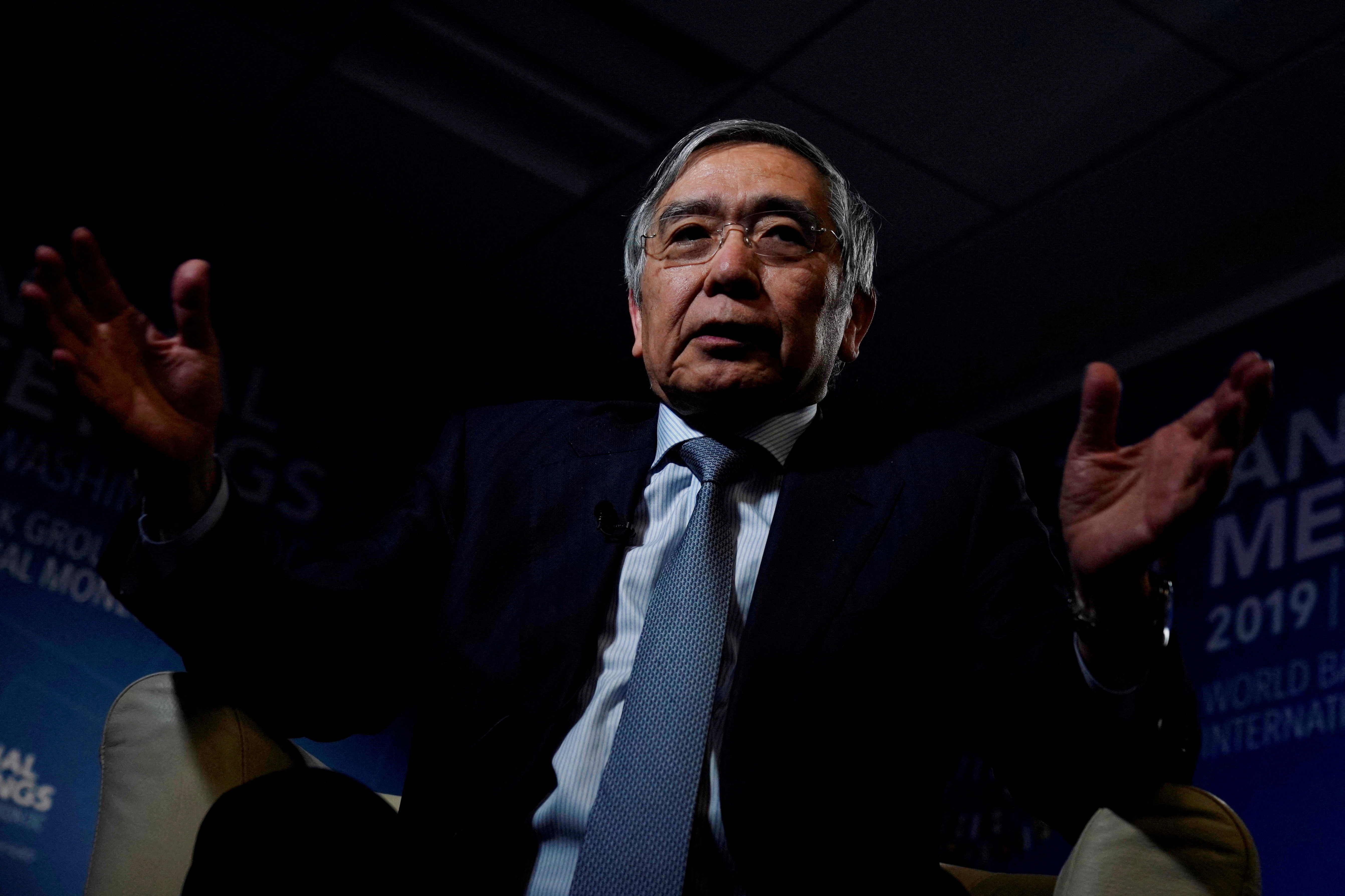Bank of Japan (BOJ) Governor Haruhiko Kuroda, gestures as he replies a question during an interview with Reuters in Washington