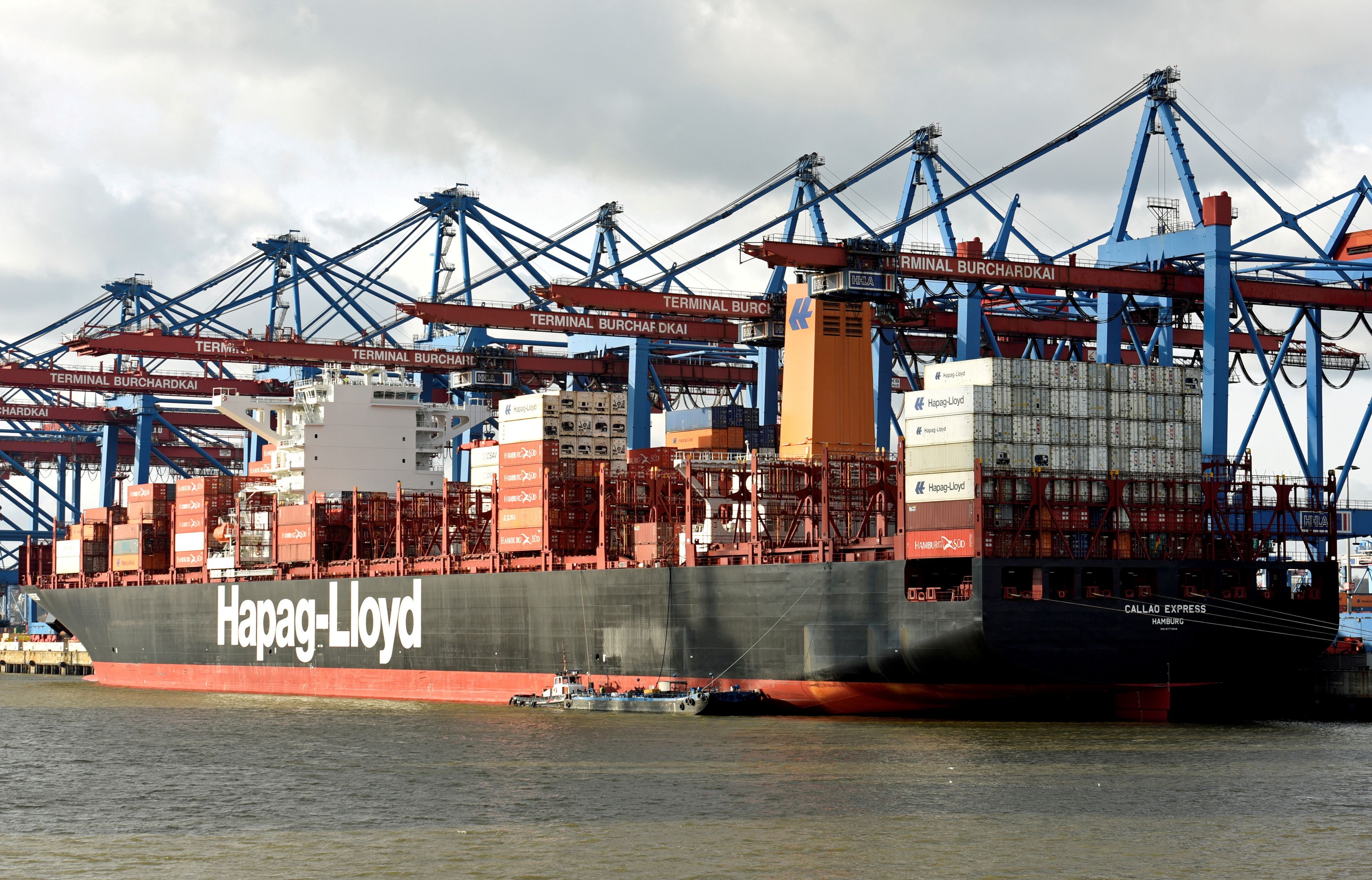 A Hapag Lloyd container ship is loaded at a shipping terminal in the harbour of Hamburg