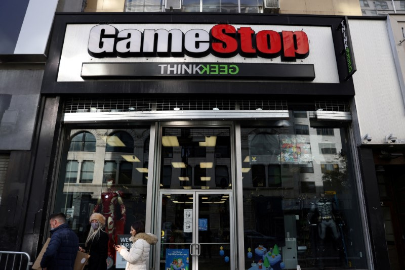 People walk by a GameStop in Manhattan, New York