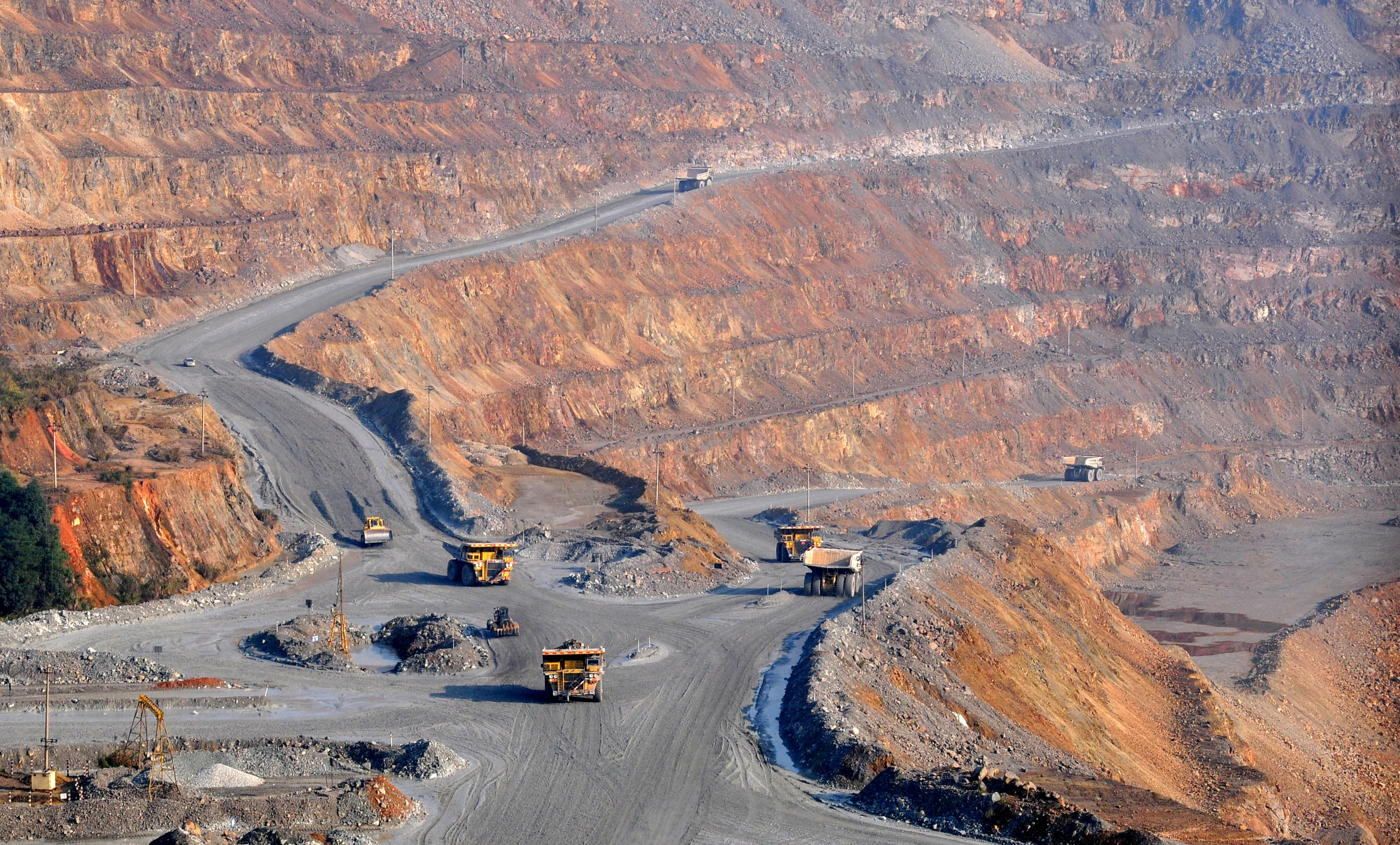 Trucks are seen at a copper mine of Jiangxi Copper in Dexing, Jiangxi