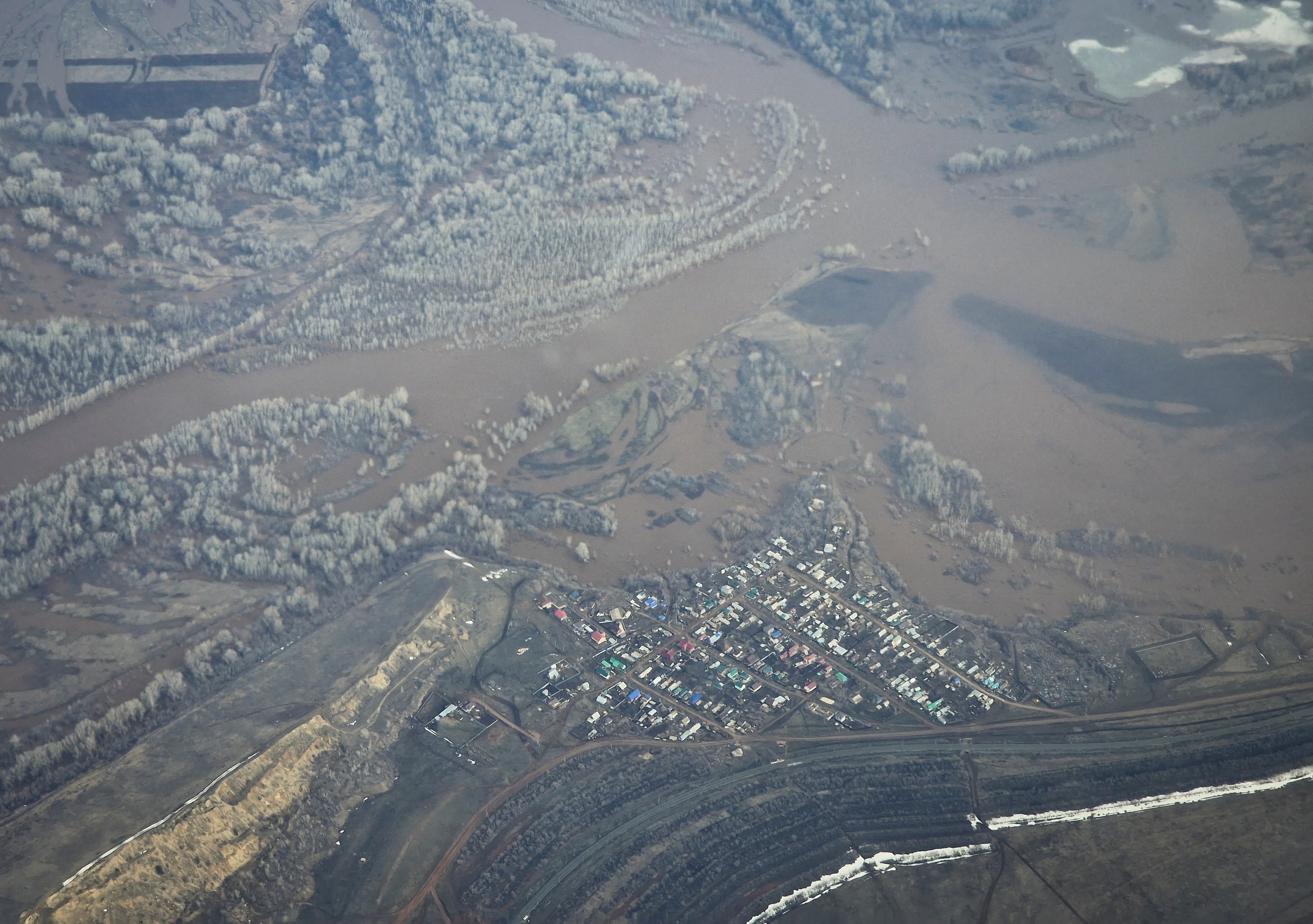 An aerial picture taken from a plane shows a flooded area near the city of Orenburg