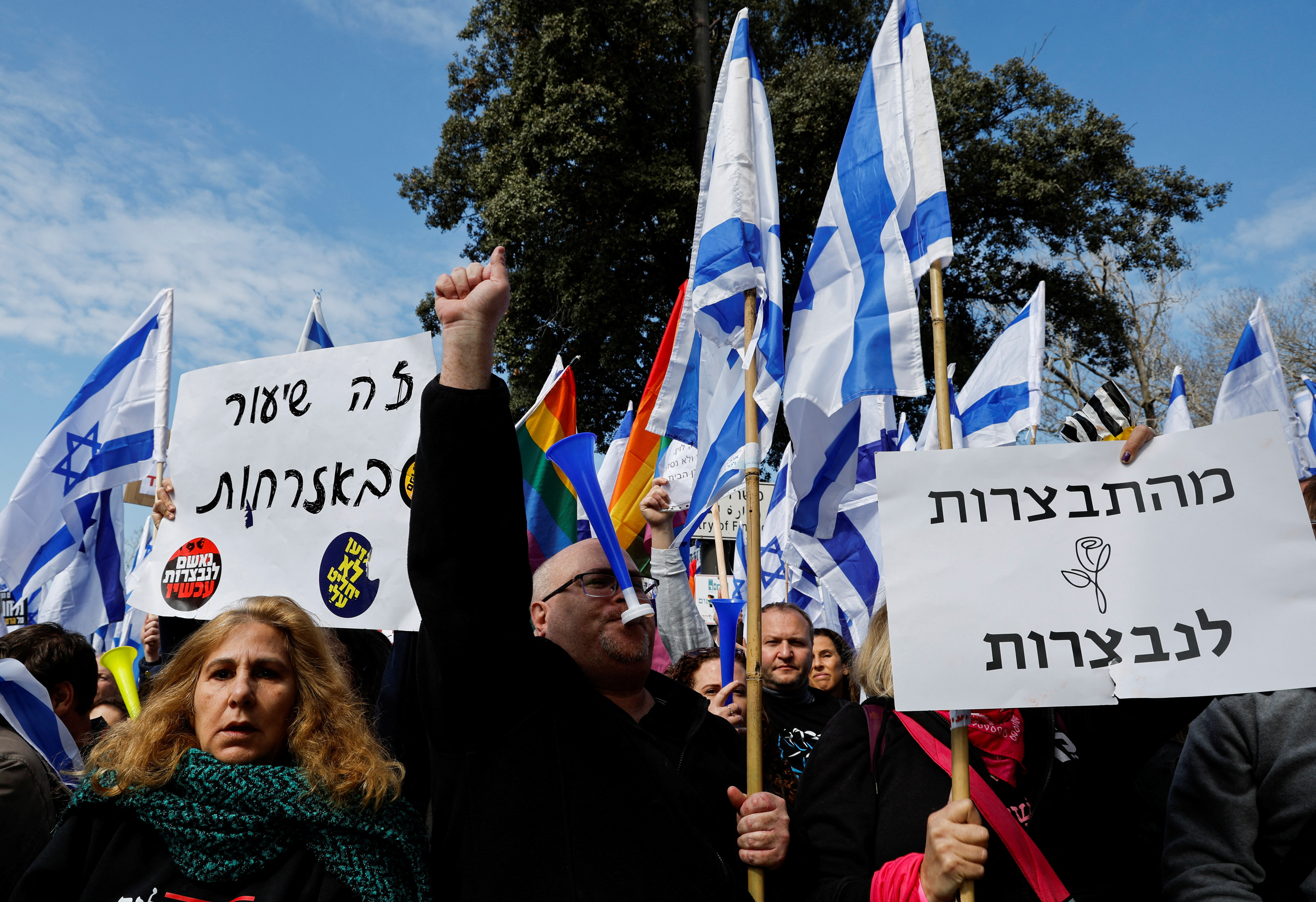 Israelis demonstrate on the day Israel's constitution committee is set to vote on judicial plan, in Jerusalem