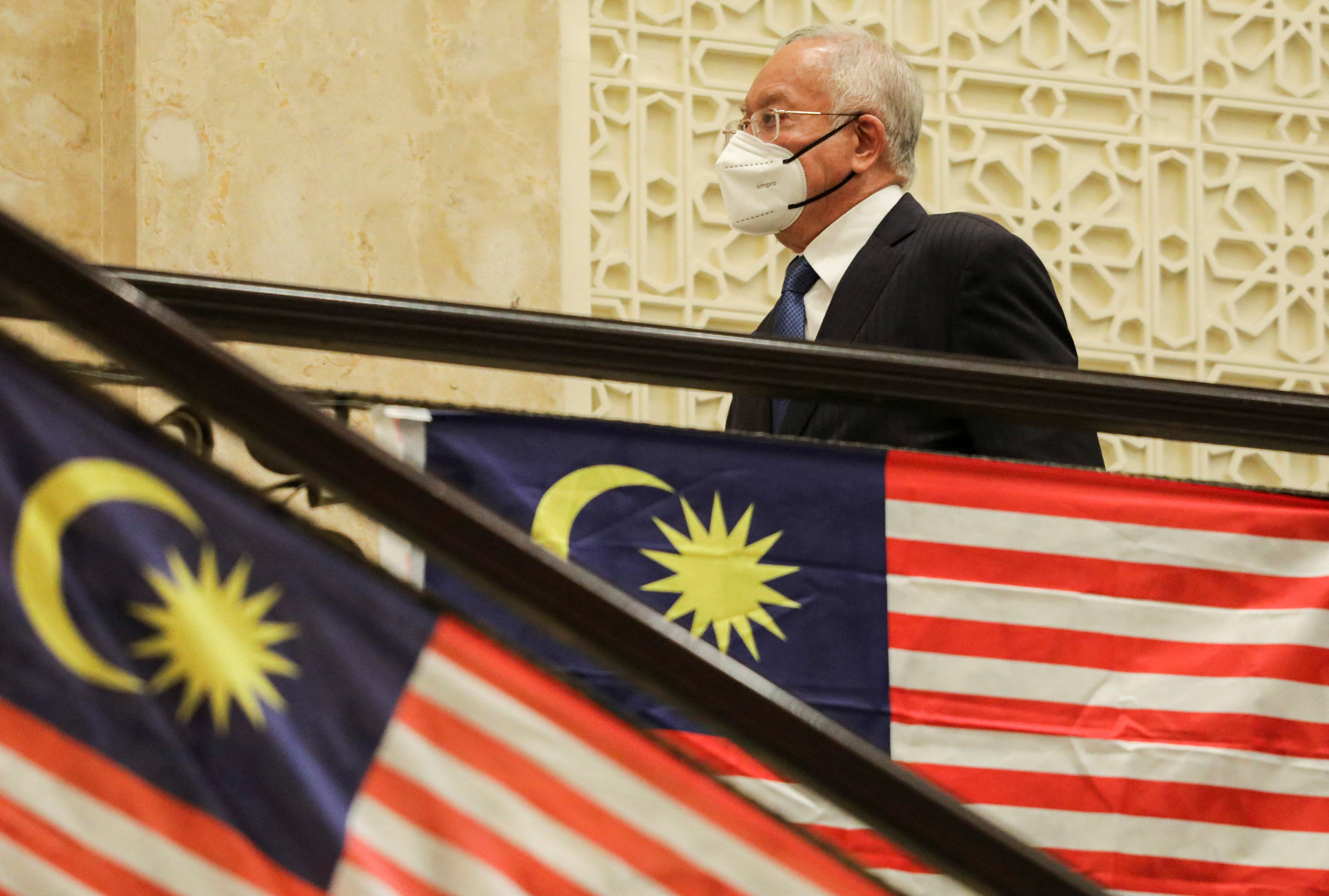 Former Malaysian Prime Minister Najib Razak walks during the break of his court proceeding at the Federal Court, in Putrajaya