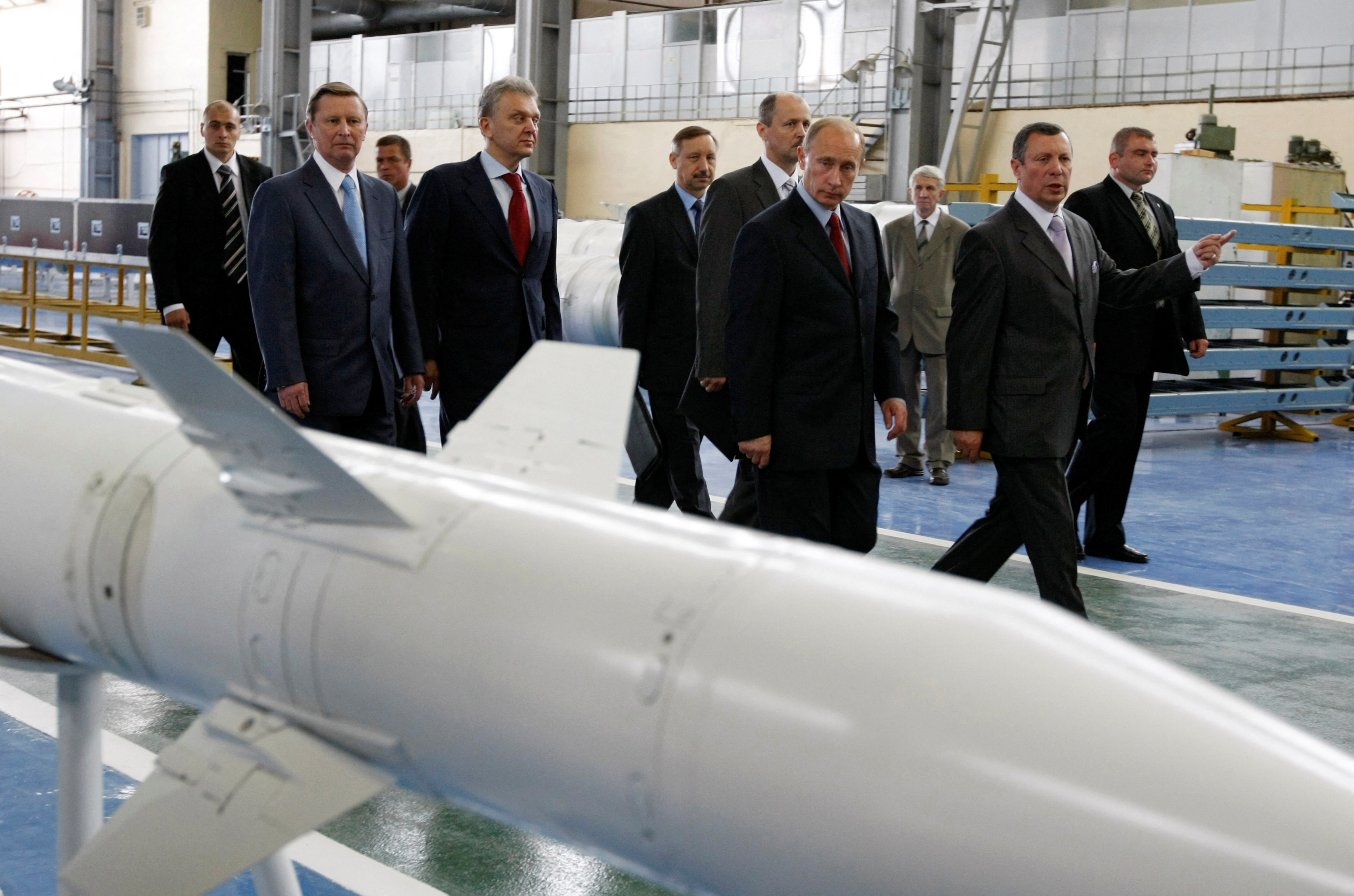 FILE PHOTO: Russian Deputy Prime Minister Sergei Ivanov (2nd L), Industry and Trade Minister Viktor Khristenko (4th L) and Prime Minister Vladimir Putin (4th R) visit the Almaz-Antey Air Defense plant in Moscow July 28, 2008.     REUTERS/RIA Novosti